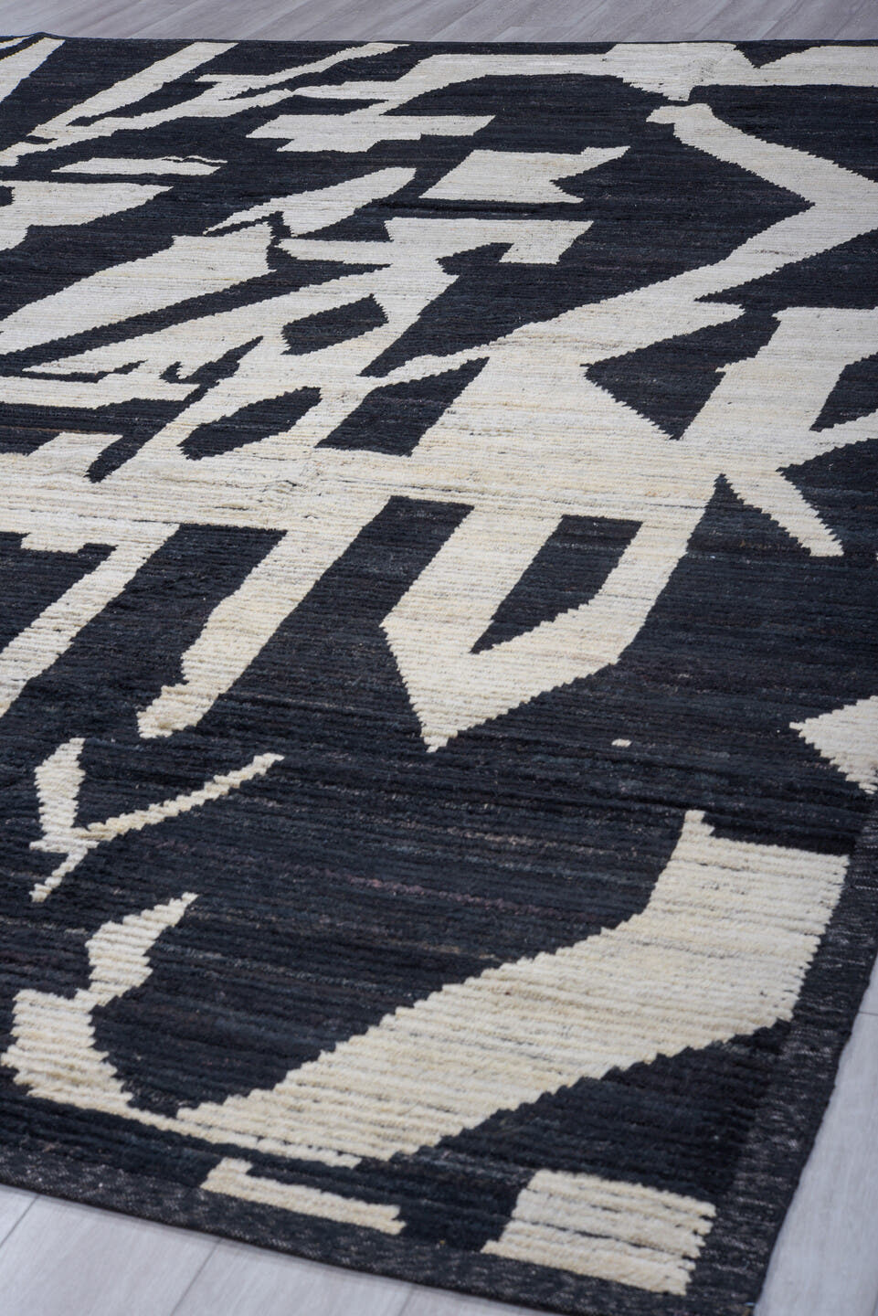 11' x 14' one-of-a-kind handmade vintage Tulu oversize rug. Color palette: black, ivory