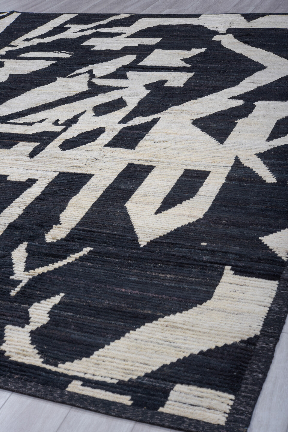 11' x 14' one-of-a-kind handmade vintage Tulu oversize rug. Color palette: black, ivory
