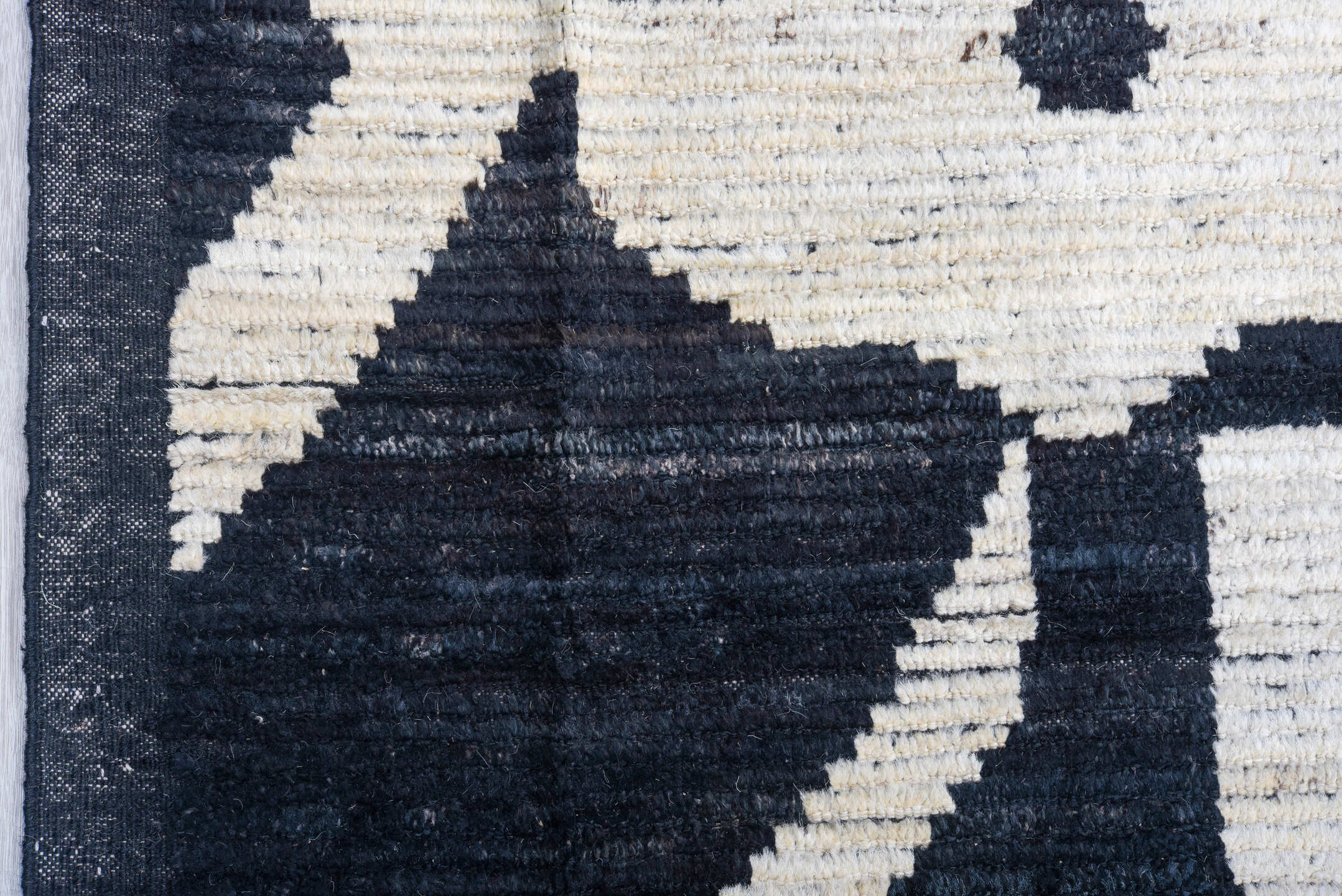 11' x 14' one-of-a-kind handmade vintage Tulu oversize rug. Color palette: black, ivory