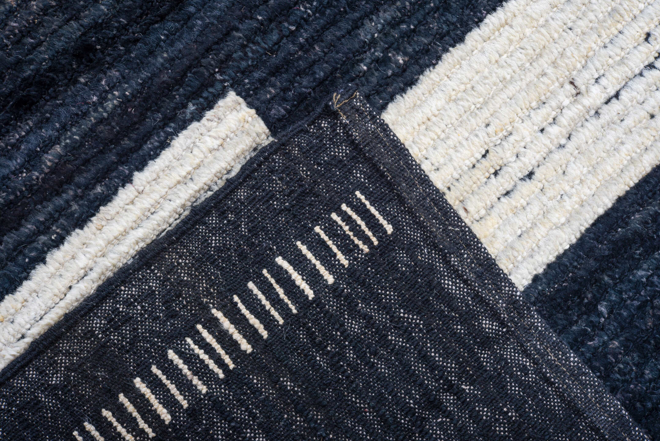 11' x 14' one-of-a-kind handmade vintage Tulu oversize rug. Color palette: black, ivory
