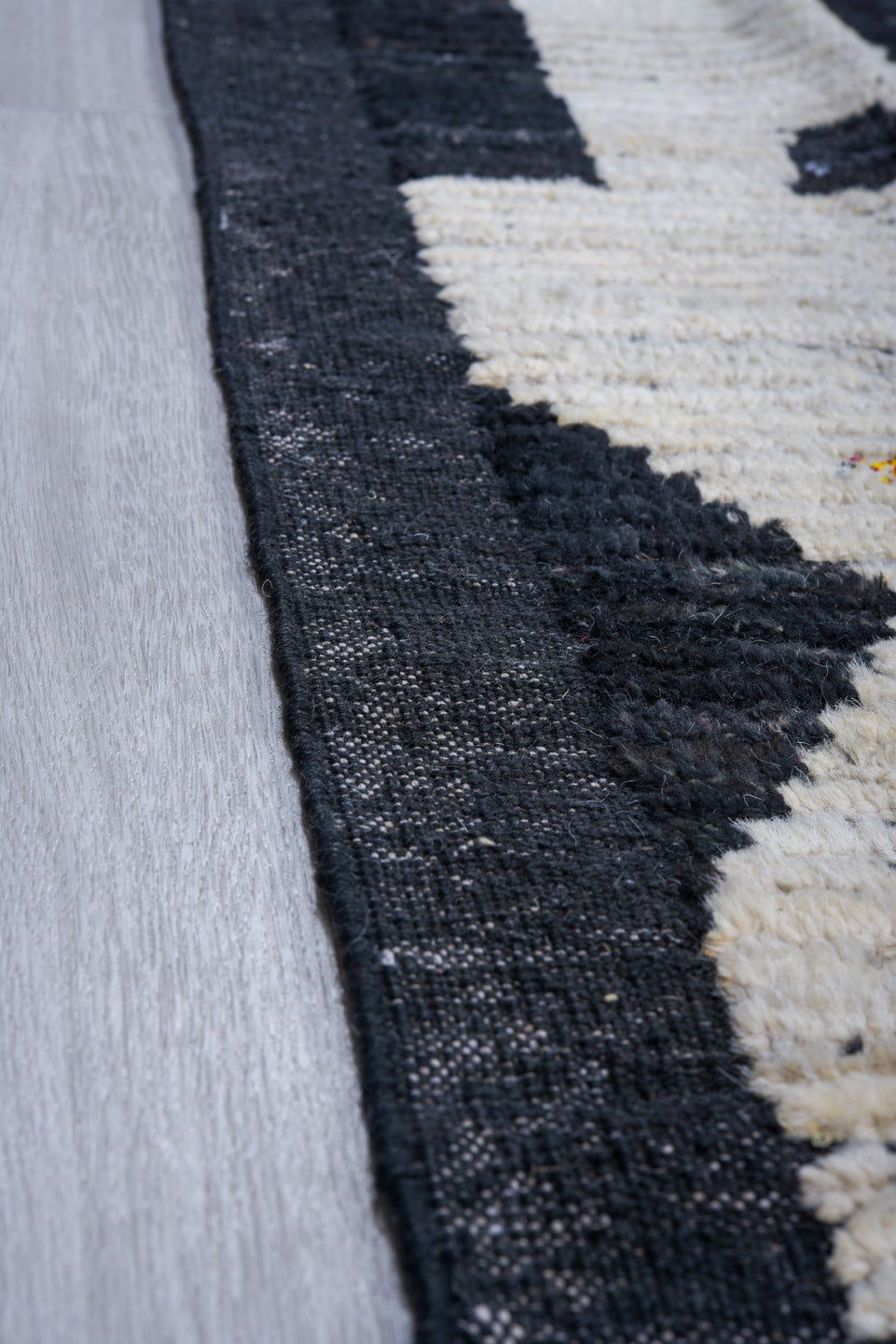 11' x 14' one-of-a-kind handmade vintage Tulu oversize rug. Color palette: black, ivory