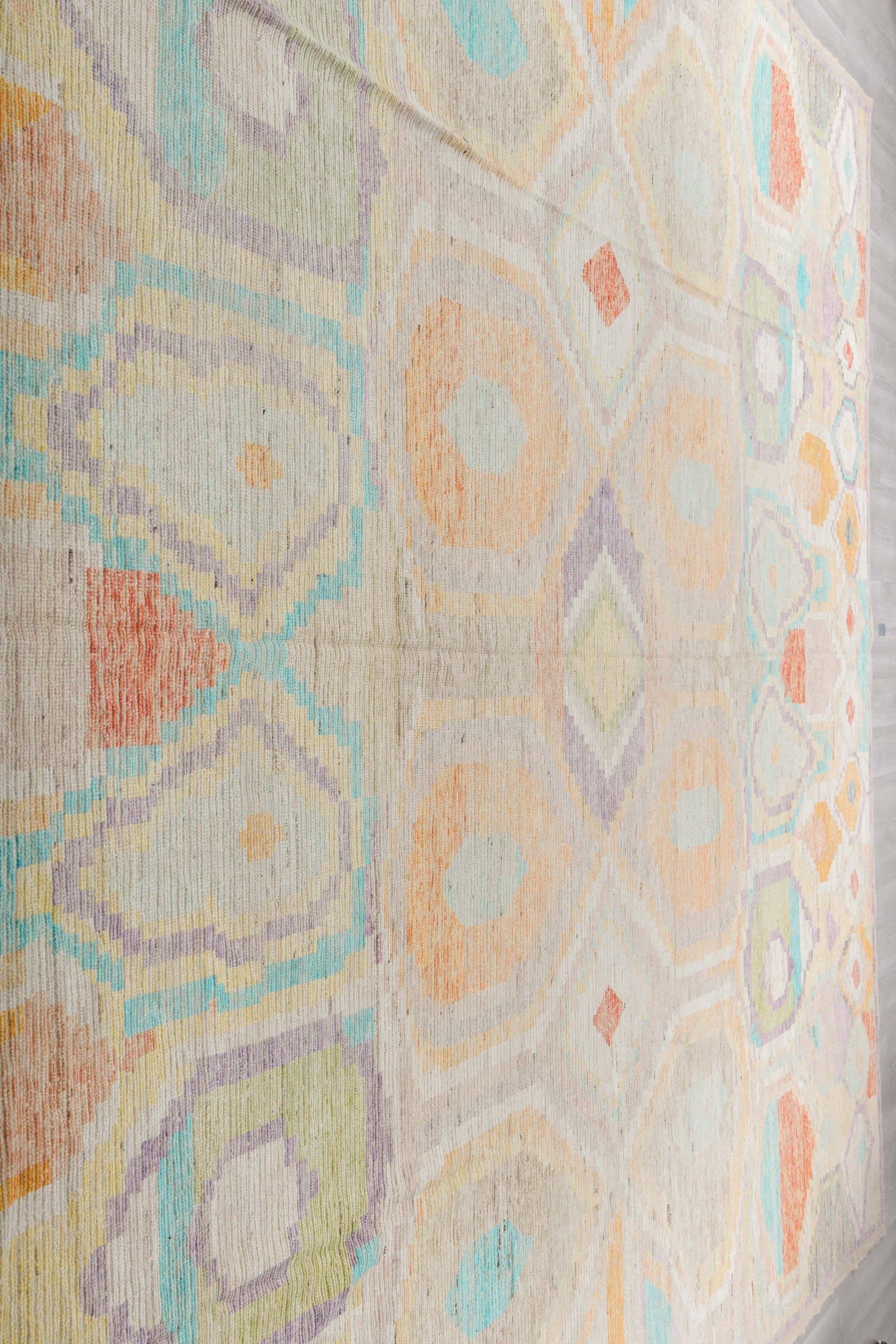 13' x 16' one-of-a-kind handmade vintage Tulu oversize rug. Color palette: ivory, aqua, apricot, lavender, taupe, coral