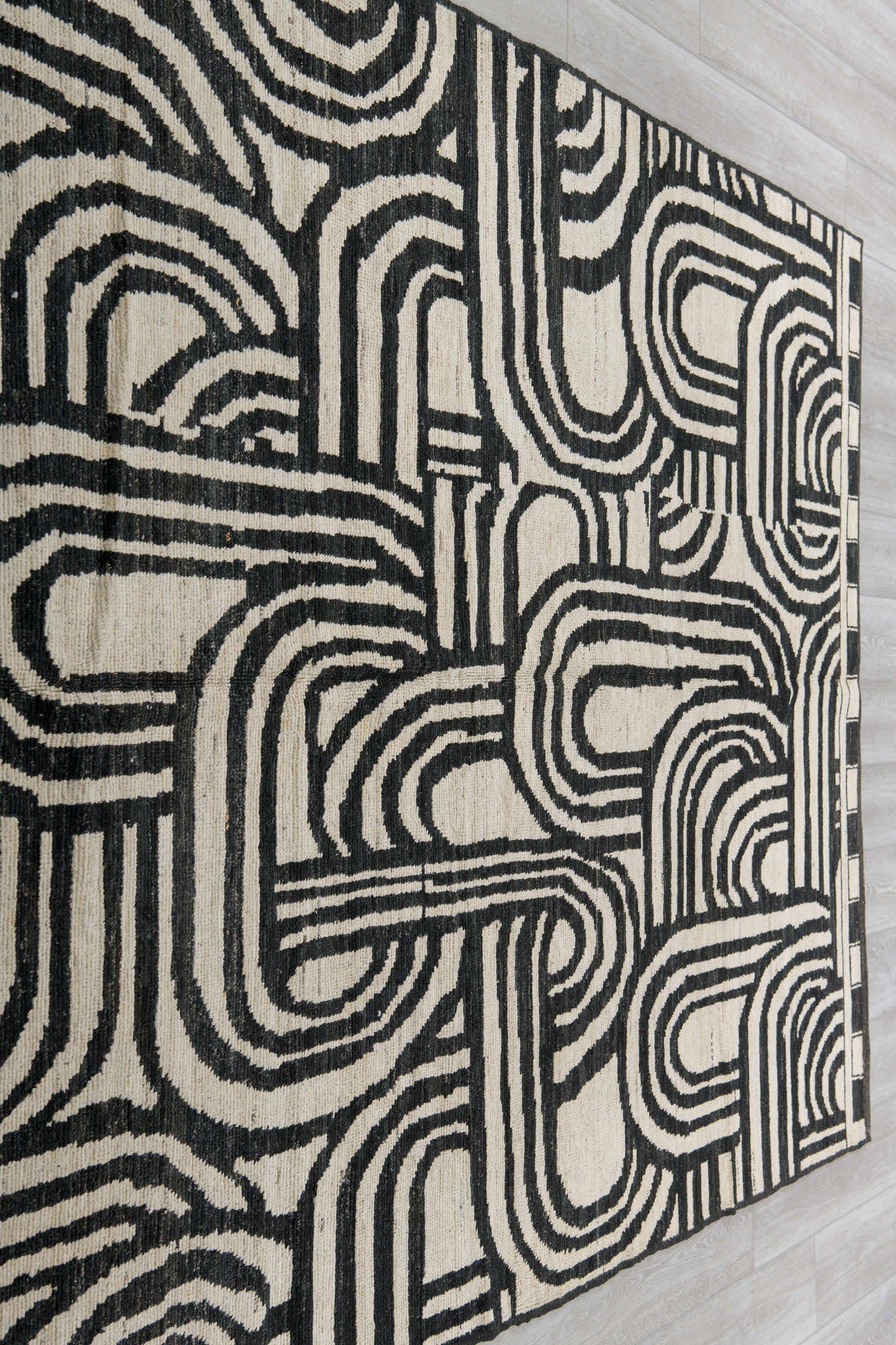 6' x 9' one-of-a-kind handmade vintage Tulu medium size rug. Color palette: ivory, charcoal, gray, black