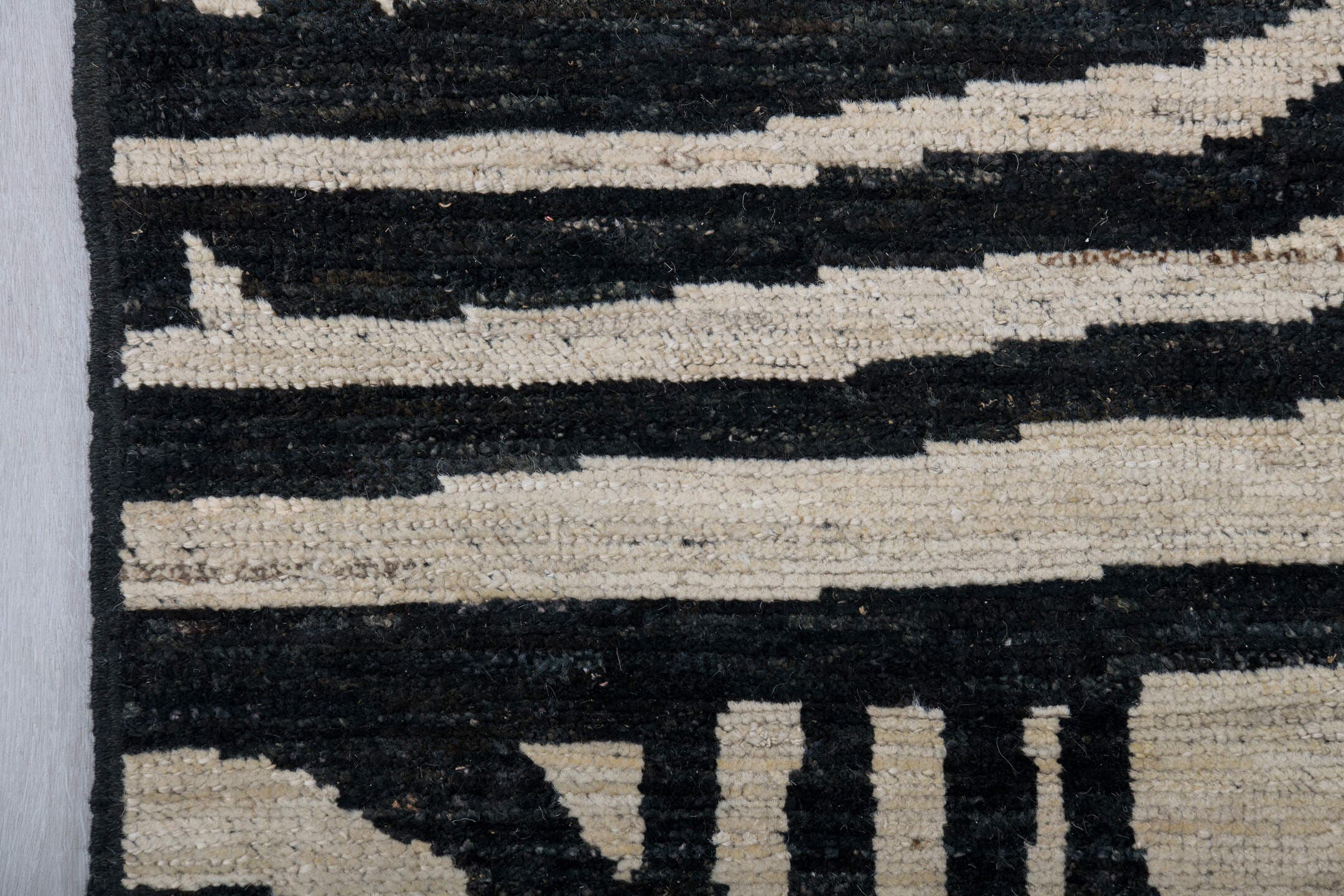6' x 9' one-of-a-kind handmade vintage Tulu medium size rug. Color palette: ivory, charcoal, gray, black