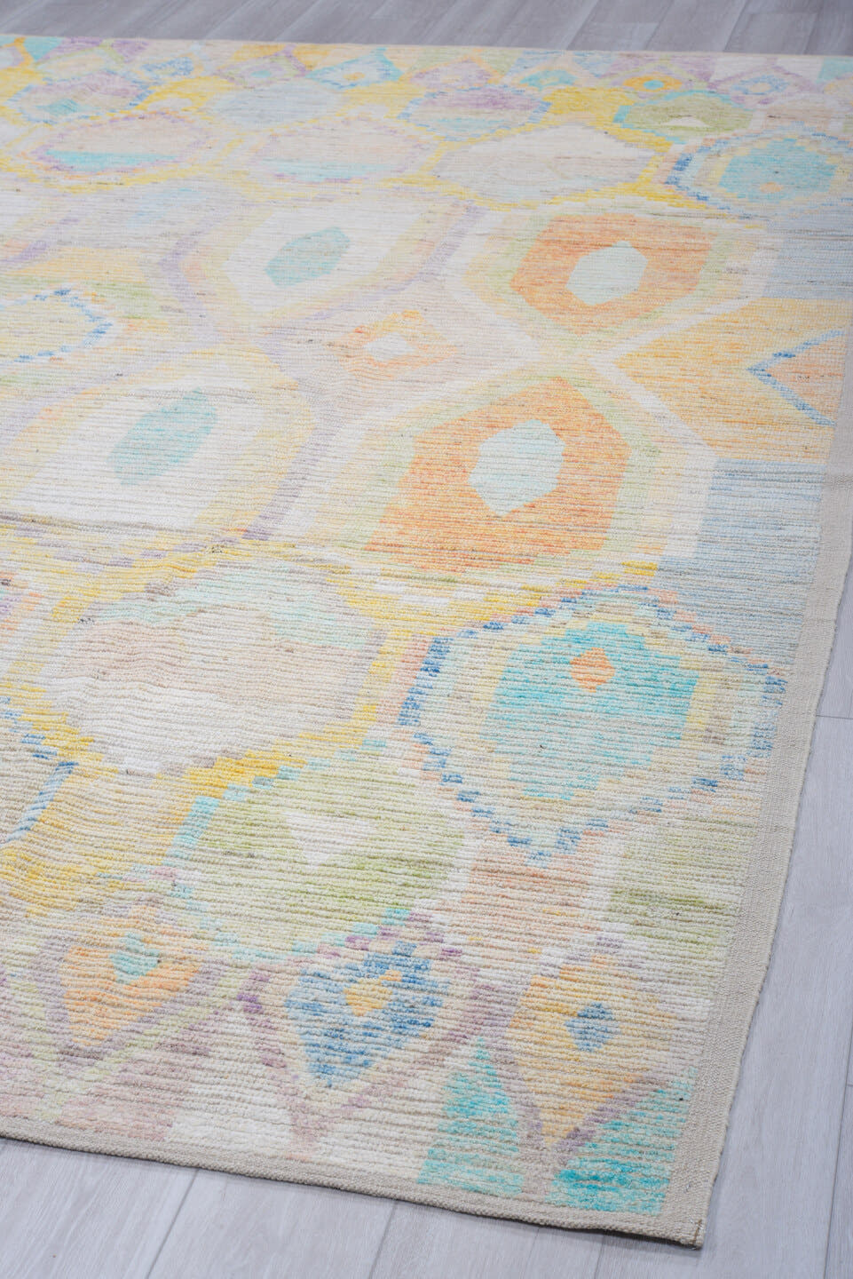 9' x 12' one-of-a-kind handmade vintage Tulu large size rug. Color palette: ivory, aqua, sky blue, peach, pale yellow