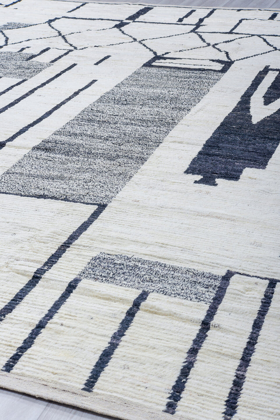 12' x 14' one-of-a-kind handmade vintage Tulu oversize rug. Color palette: ivory, charcoal, gray, black