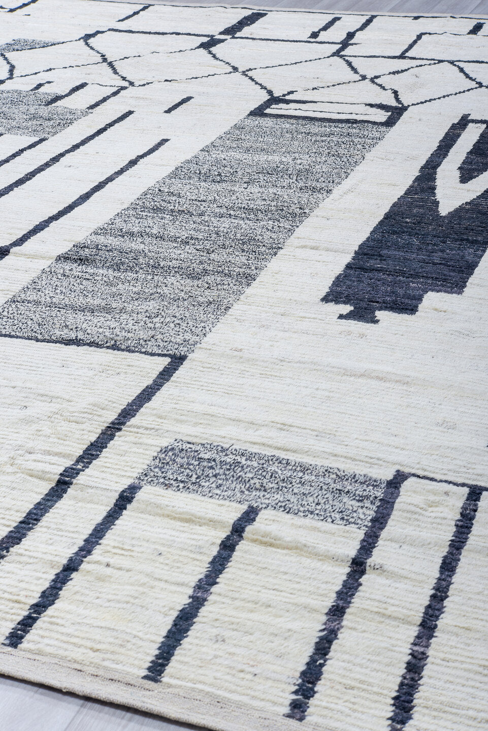 12' x 14' one-of-a-kind handmade vintage Tulu oversize rug. Color palette: ivory, charcoal, gray, black