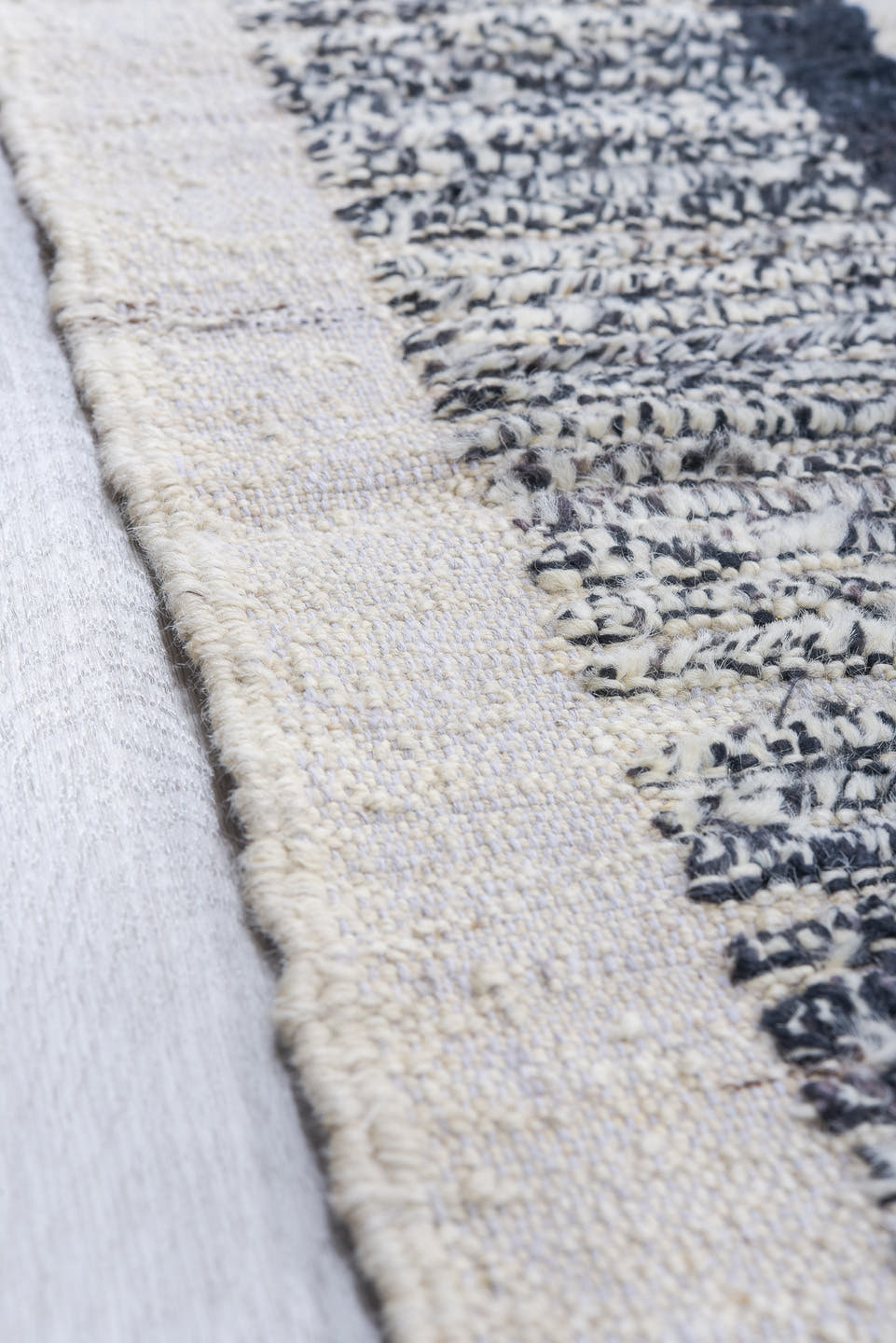 12' x 14' one-of-a-kind handmade vintage Tulu oversize rug. Color palette: ivory, charcoal, gray, black