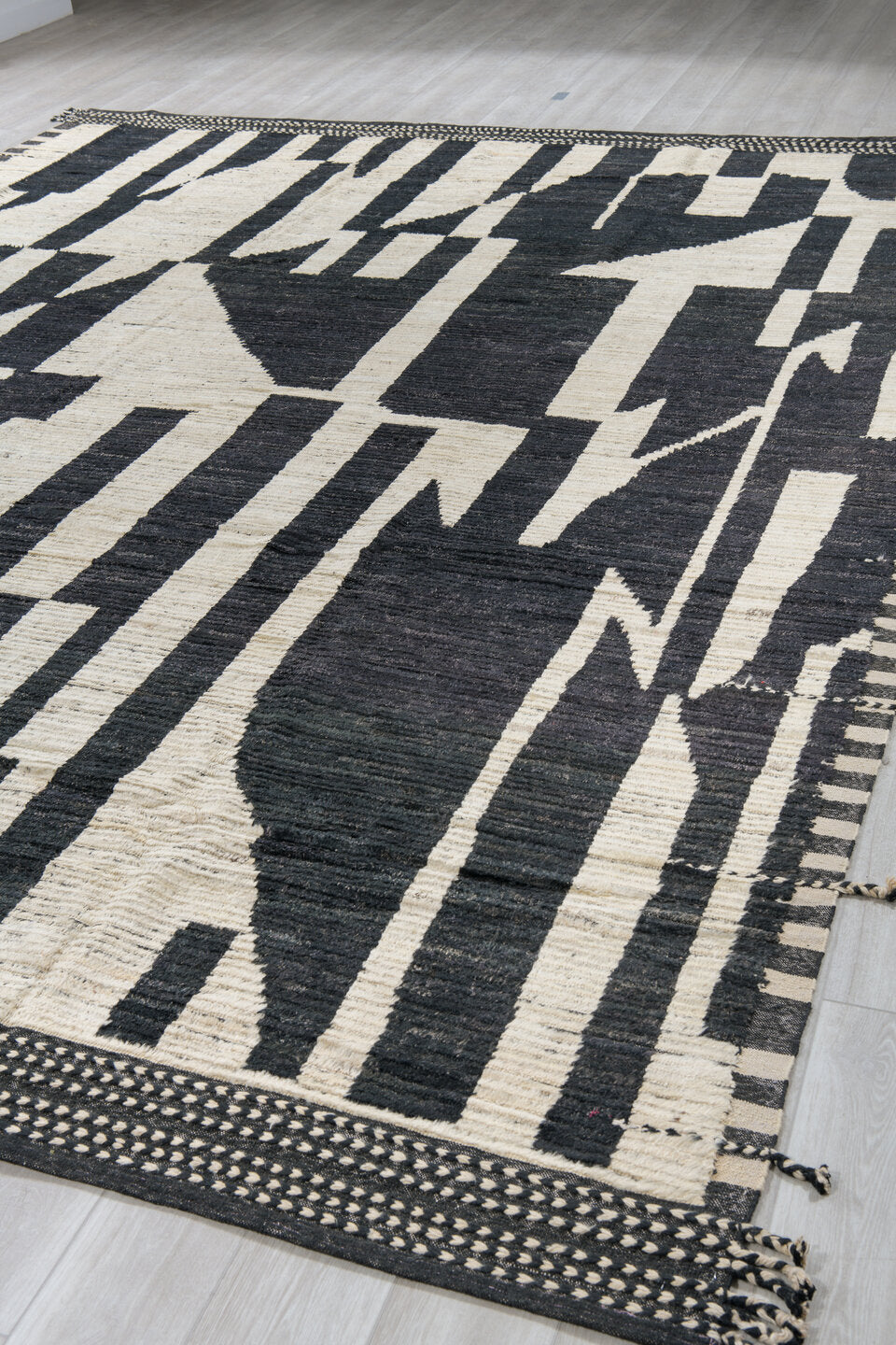11' x 14' one-of-a-kind handmade vintage Tulu oversize rug. Color palette: ivory, black, charcoal, gray