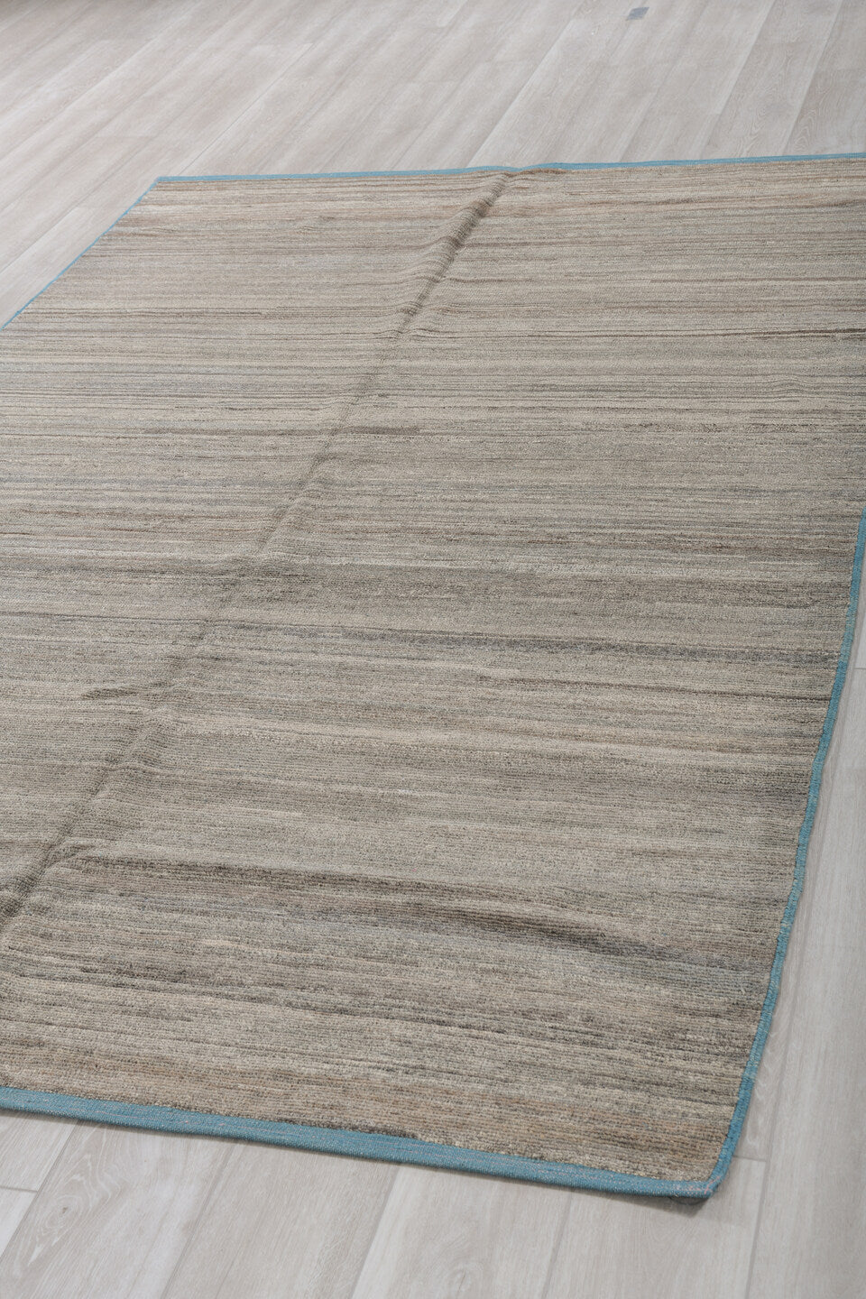6' x 9' one-of-a-kind handmade vintage Tulu medium size rug. Color palette: taupe, ivory, charcoal, camel, sky_blue, beige