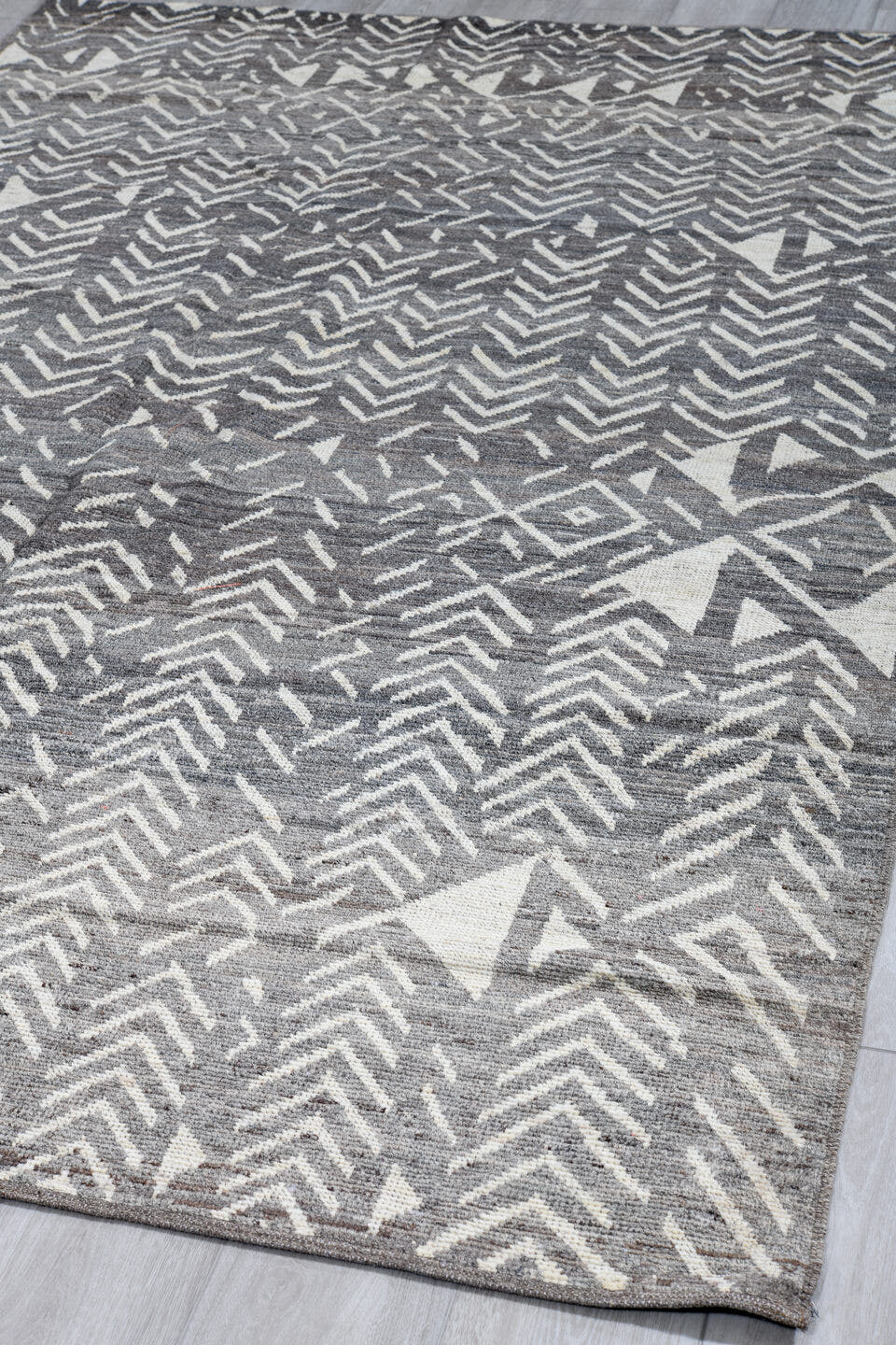 5' x 9' one-of-a-kind handmade vintage Tulu medium size rug. Color palette: gray, ivory, charcoal, taupe, black, beige