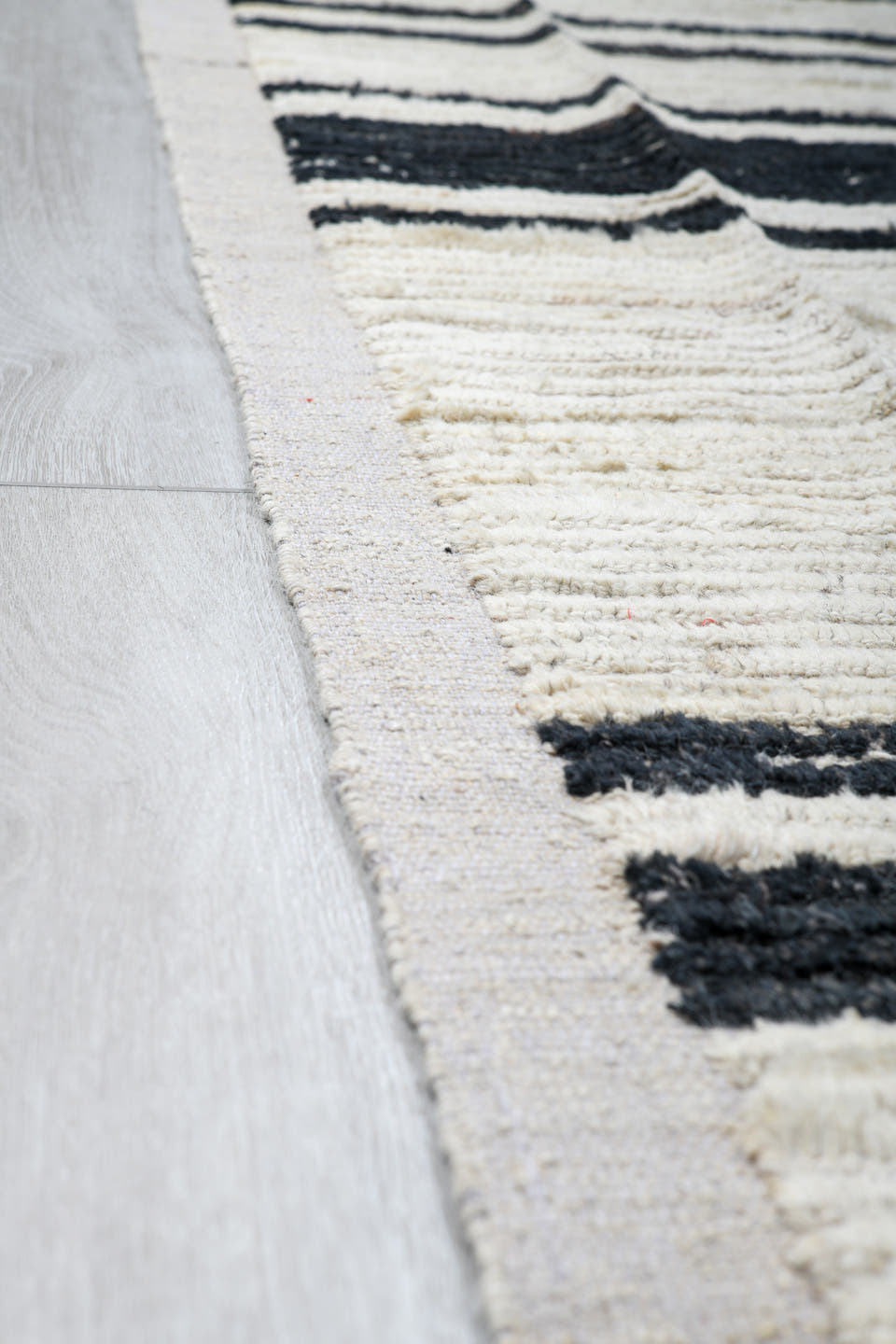 10' x 14' one-of-a-kind handmade vintage Tulu large size rug. Color palette: ivory, charcoal, black, gray