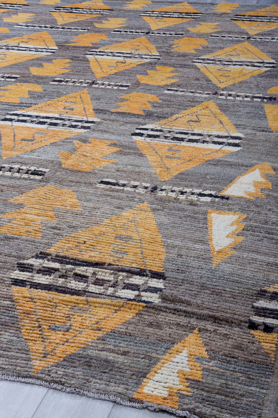 11' x 14' one-of-a-kind handmade vintage Tulu oversize rug. Color palette: gray, gold, ivory, charcoal, taupe, black, beige