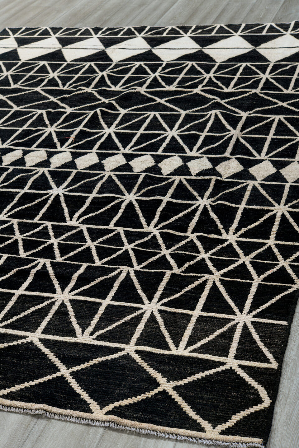 7' x 10' one-of-a-kind handmade vintage Tulu large size rug. Color palette: black, ivory