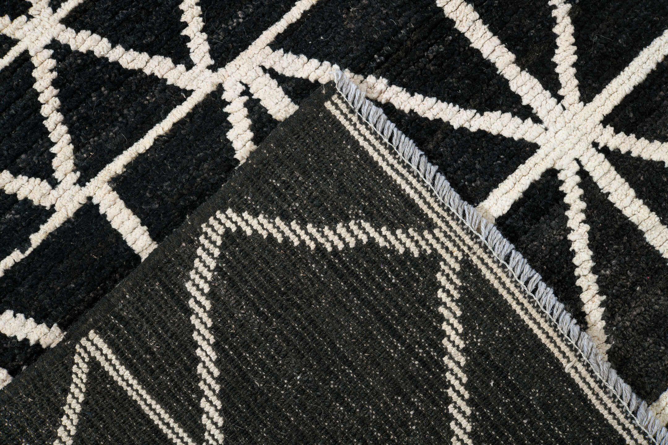 7' x 10' one-of-a-kind handmade vintage Tulu large size rug. Color palette: black, ivory