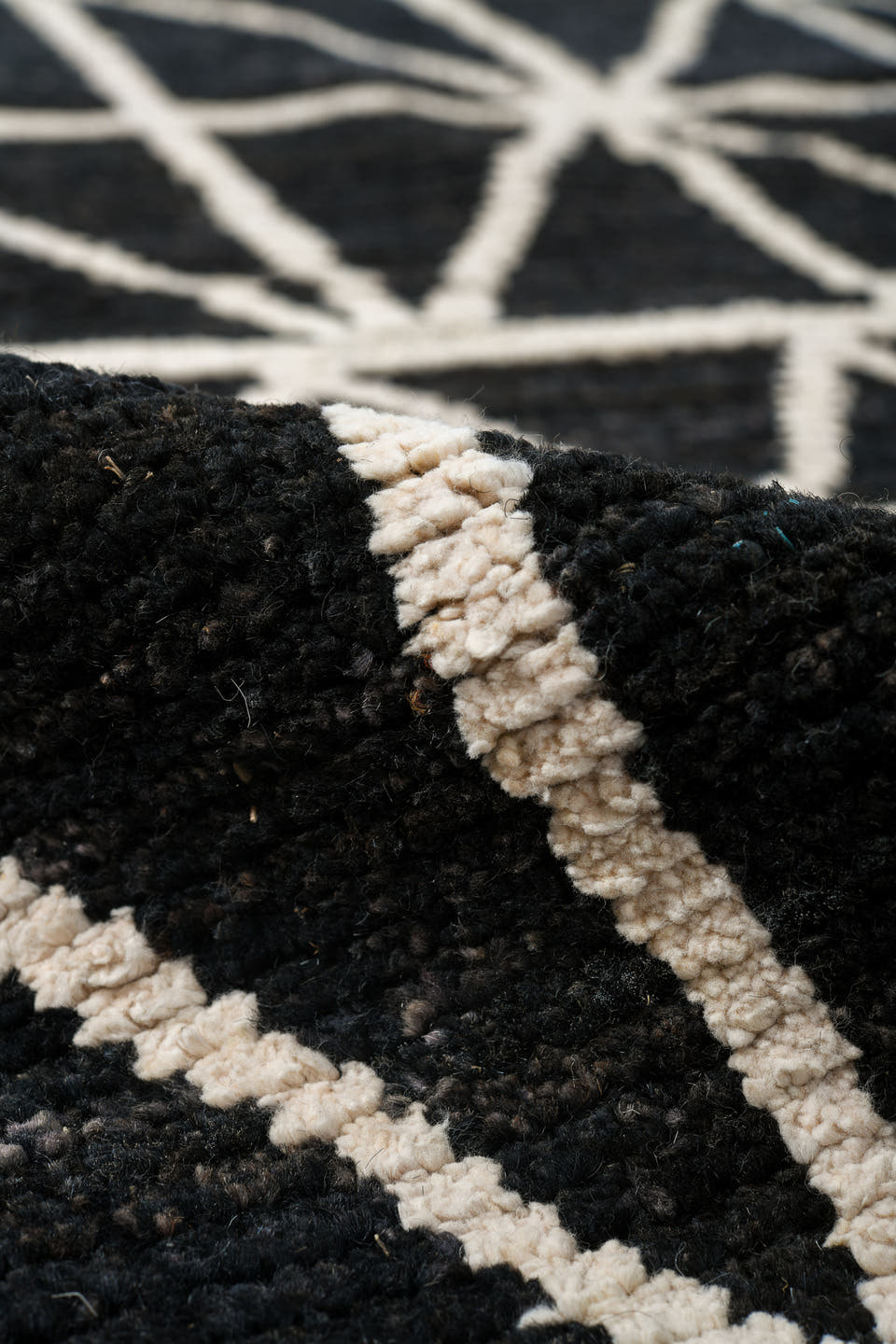 7' x 10' one-of-a-kind handmade vintage Tulu large size rug. Color palette: black, ivory