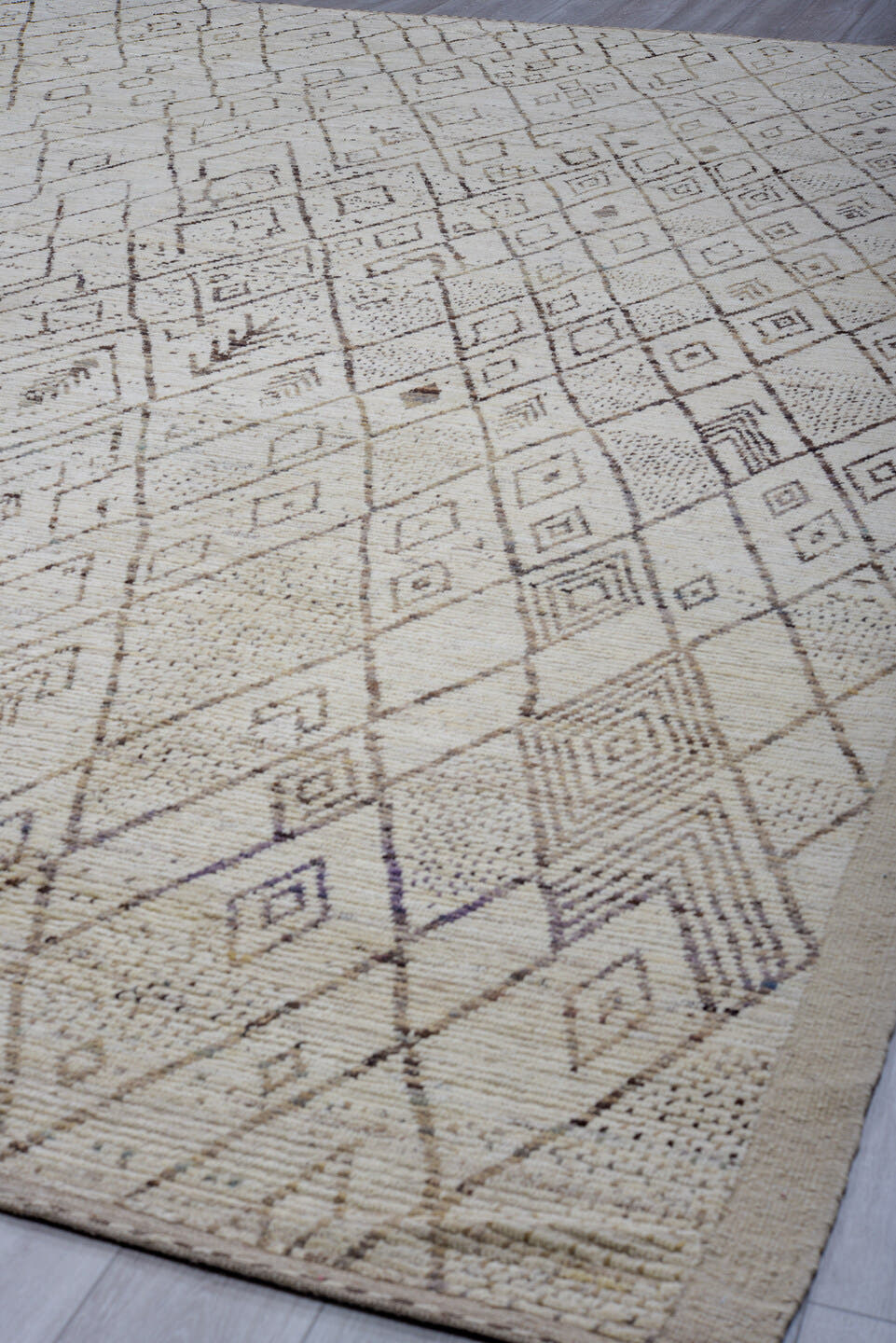 12' x 17' one-of-a-kind handmade vintage Tulu oversize rug. Color palette: ivory, taupe, brown, beige, camel, gray