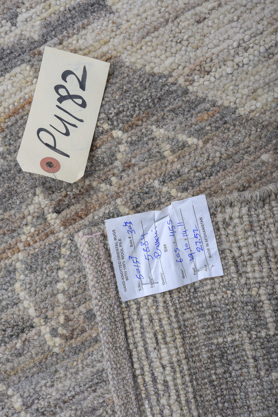 12' x 17' one-of-a-kind handmade vintage Tulu oversize rug. Color palette: ivory, taupe, brown, beige, camel, gray