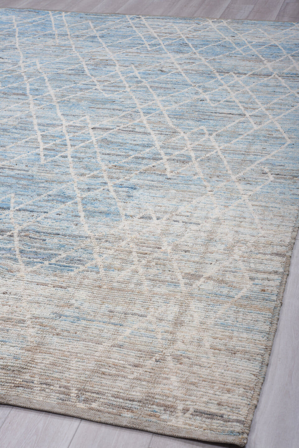 9' x 12' one-of-a-kind handmade vintage Tulu large size rug. Color palette: sky blue, ivory, silver, pale gray, light blue