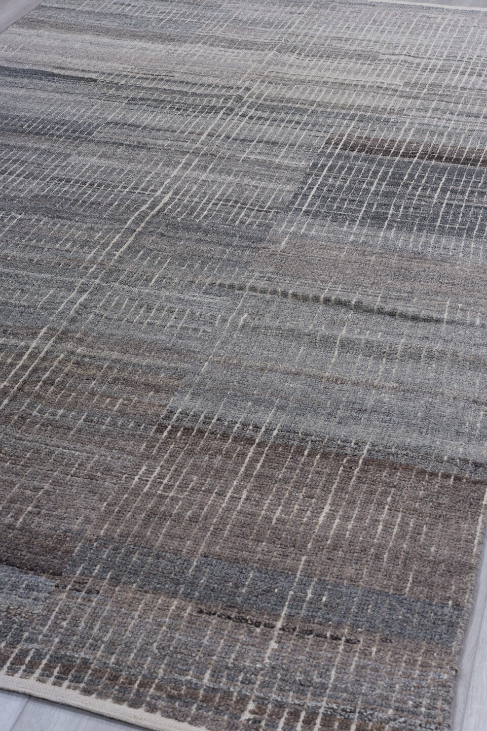 5' x 9' one-of-a-kind handmade vintage Tulu medium size rug. Color palette: gray, charcoal, taupe, ivory, greige, brown