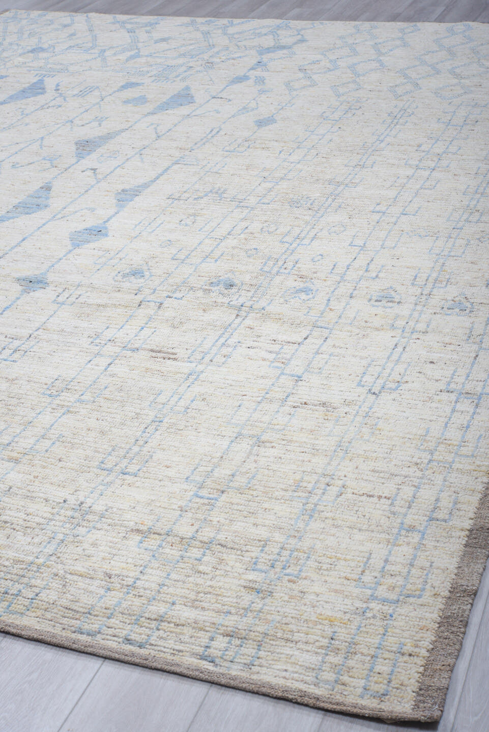 9' x 12' one-of-a-kind handmade vintage Tulu large size rug. Color palette: ivory, sky blue, taupe, cream, pale gray