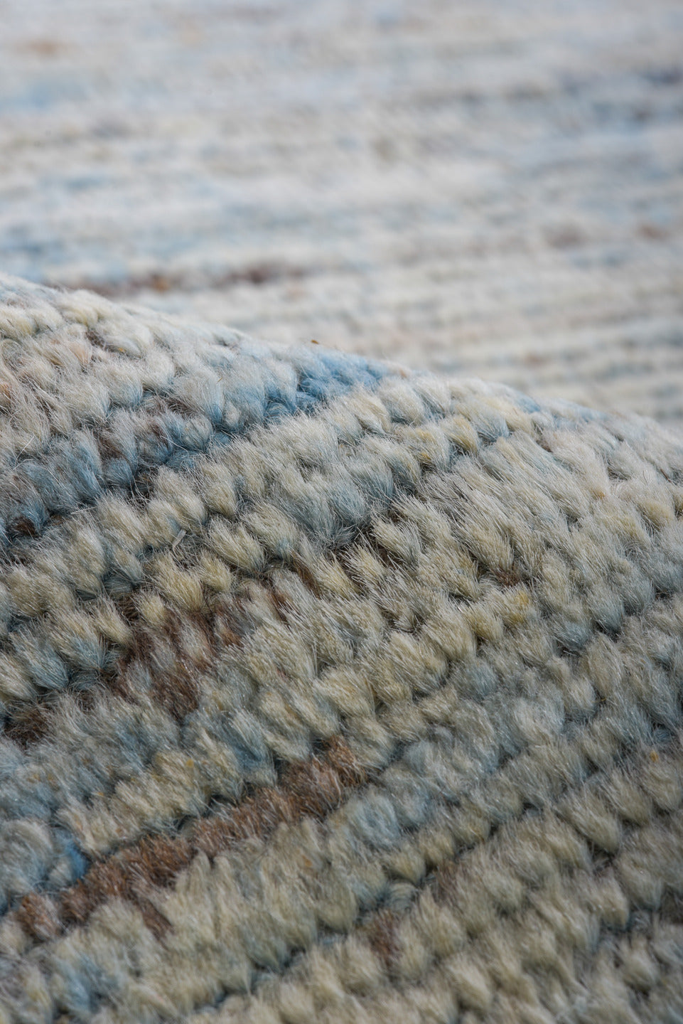 9' x 12' one-of-a-kind handmade vintage Tulu large size rug. Color palette: ivory, pale blue, sky blue, taupe, gray