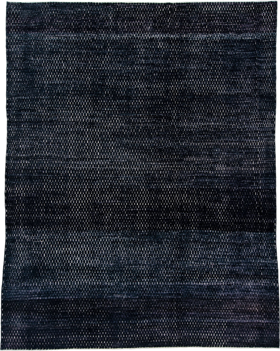 9' x 12' one-of-a-kind handmade vintage Tulu large size rug. Color palette: charcoal, indigo, slate, ivory, gray, black