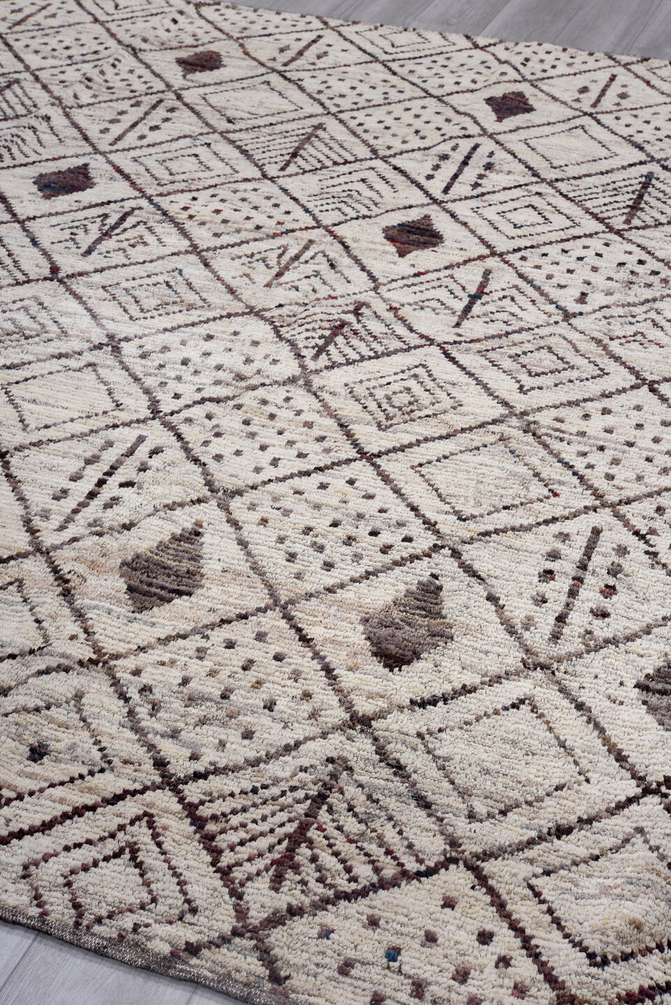 9' x 9' one-of-a-kind handmade vintage Tulu rug. Color palette: ivory, brown, taupe, charcoal, burgundy, beige, gray, black