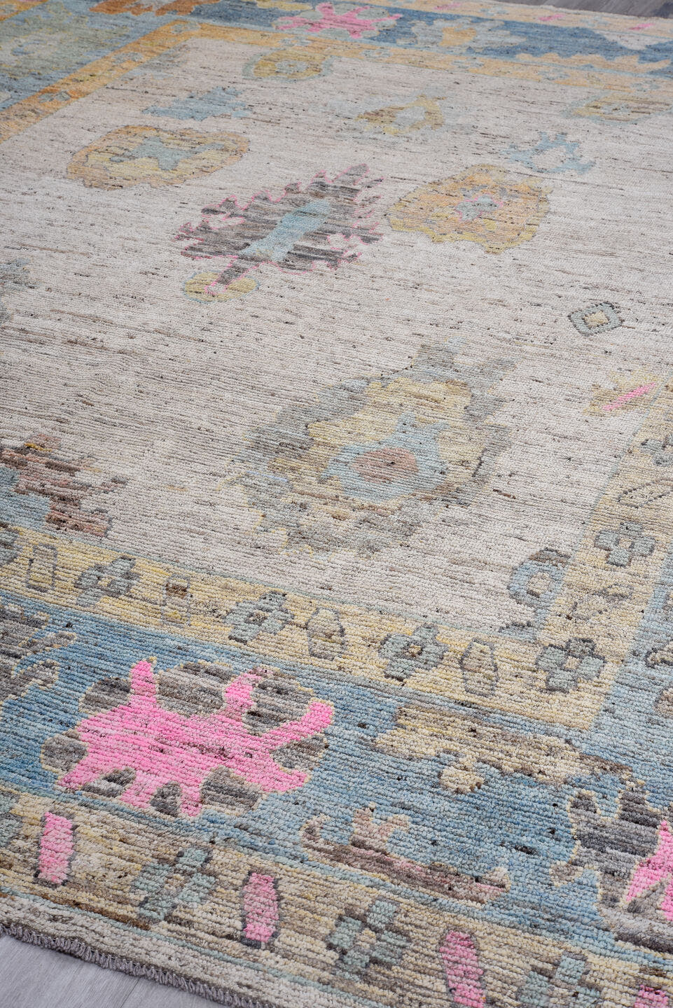 10' x 13' one-of-a-kind handmade vintage Oushak oversize rug. Color palette: ivory, pale blue, sand, pink, gold, taupe