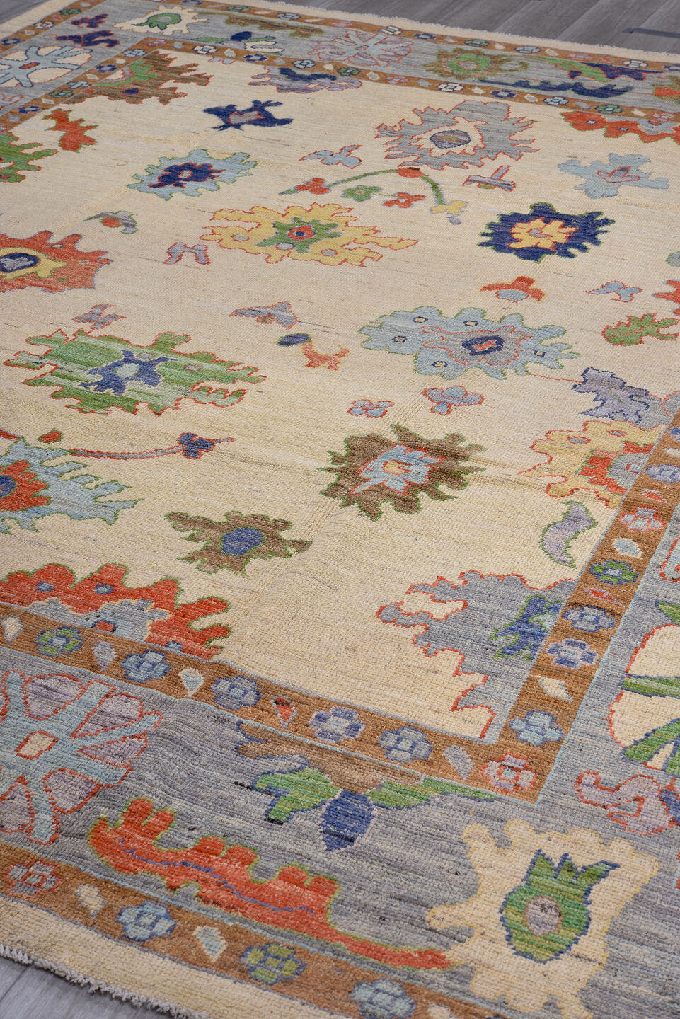 9' x 11' one-of-a-kind handmade vintage Oushak large size rug. Color palette: ivory, gray, terra cotta, sage, sky blue, navy