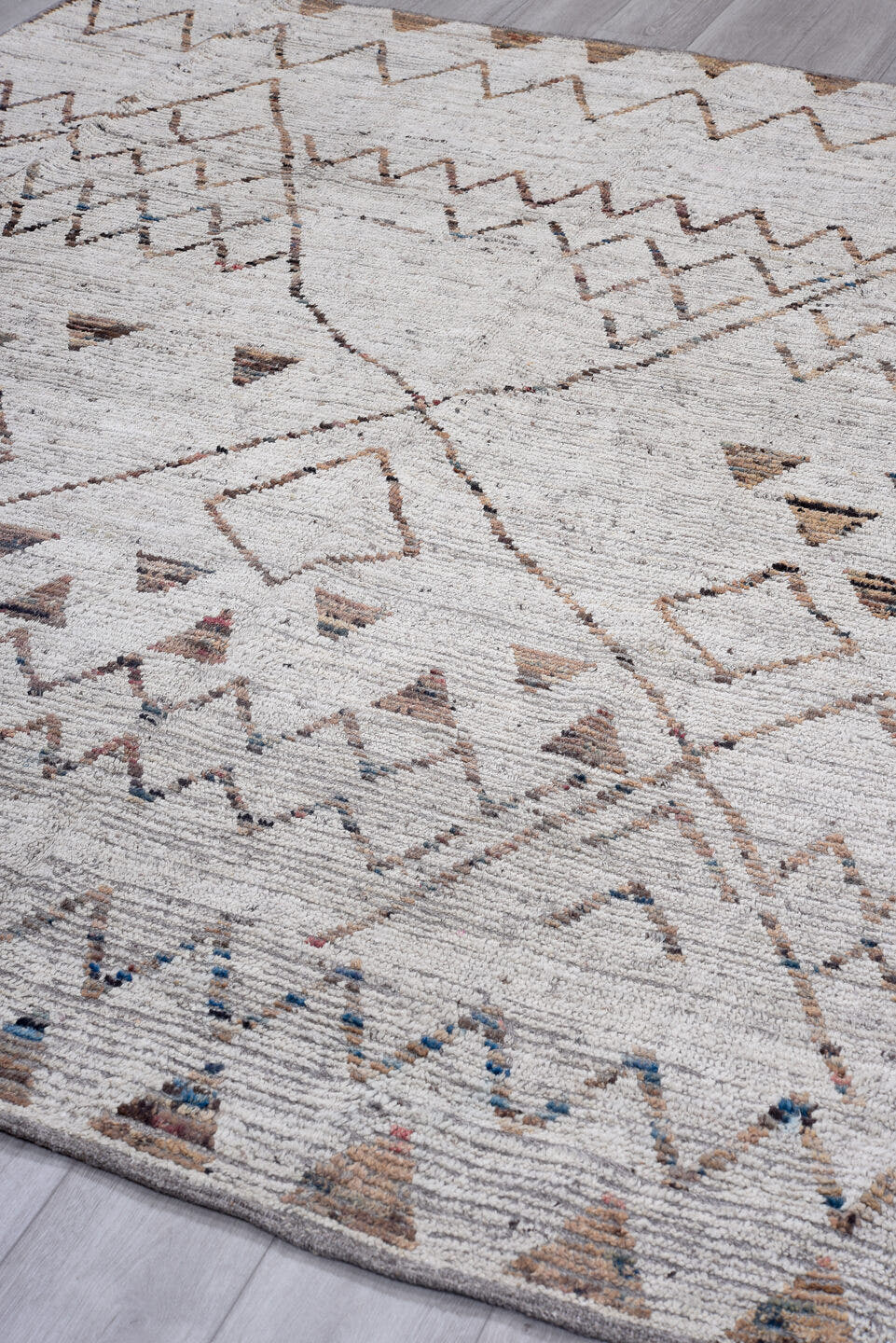 8' x 9' one-of-a-kind handmade vintage Tulu rug. Color palette: ivory, taupe, terra cotta, charcoal, slate, faded blue