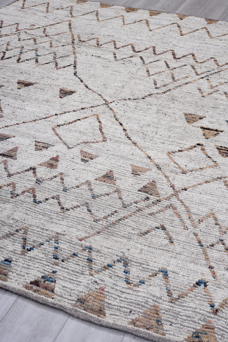 8' x 9' one-of-a-kind handmade vintage Tulu rug. Color palette: ivory, taupe, terra cotta, charcoal, slate, faded blue