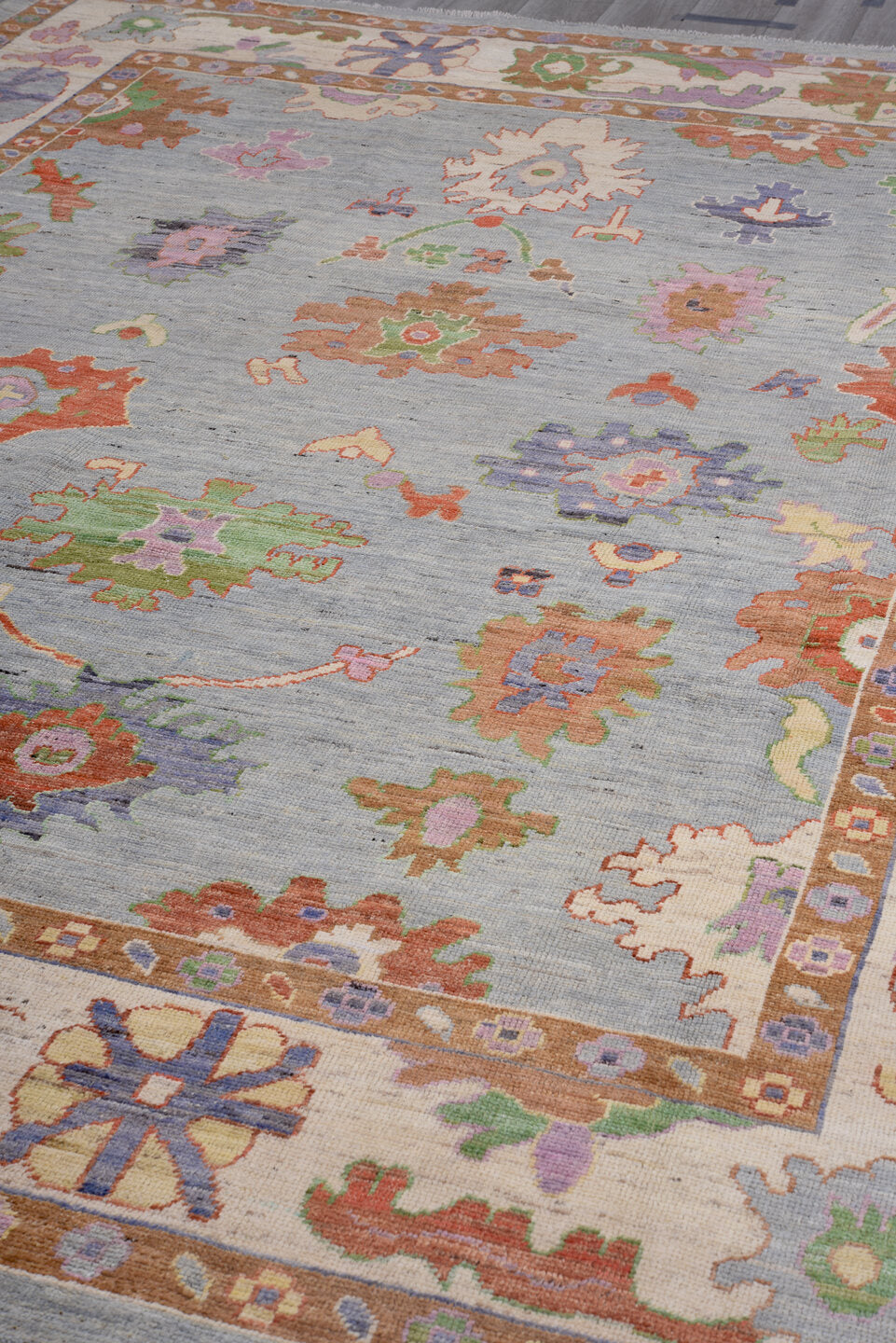 8' x 12' one-of-a-kind handmade vintage Oushak large size rug. Color palette: pale blue, ivory, rust, sage, lavender, coral