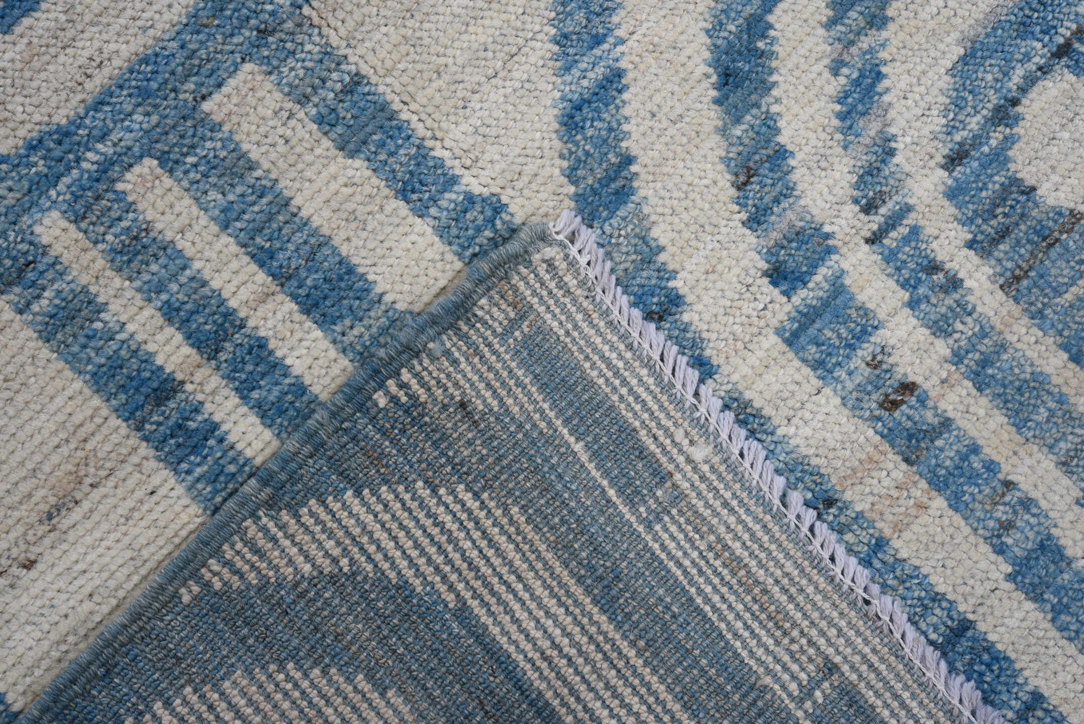 7' x 9' one-of-a-kind handmade vintage Tulu large size rug. Color palette: ivory, sky blue, slate, cream, light blue, gray