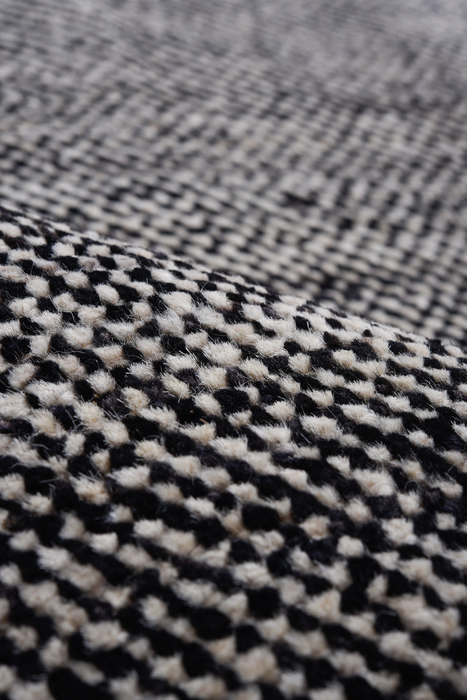 8' x 9' one-of-a-kind handmade vintage Tulu rug. Color palette: charcoal, ivory, taupe, rust, gold, slate, blue, gray, black