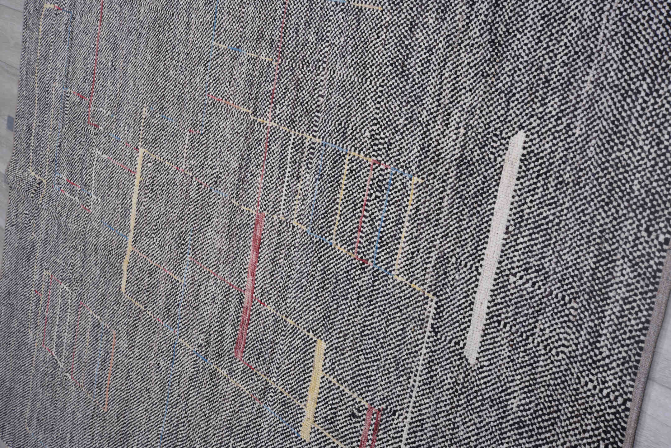 6' x 8' one-of-a-kind handmade vintage Tulu medium size rug. Color palette: charcoal, ivory, red, blue, gold, gray, black
