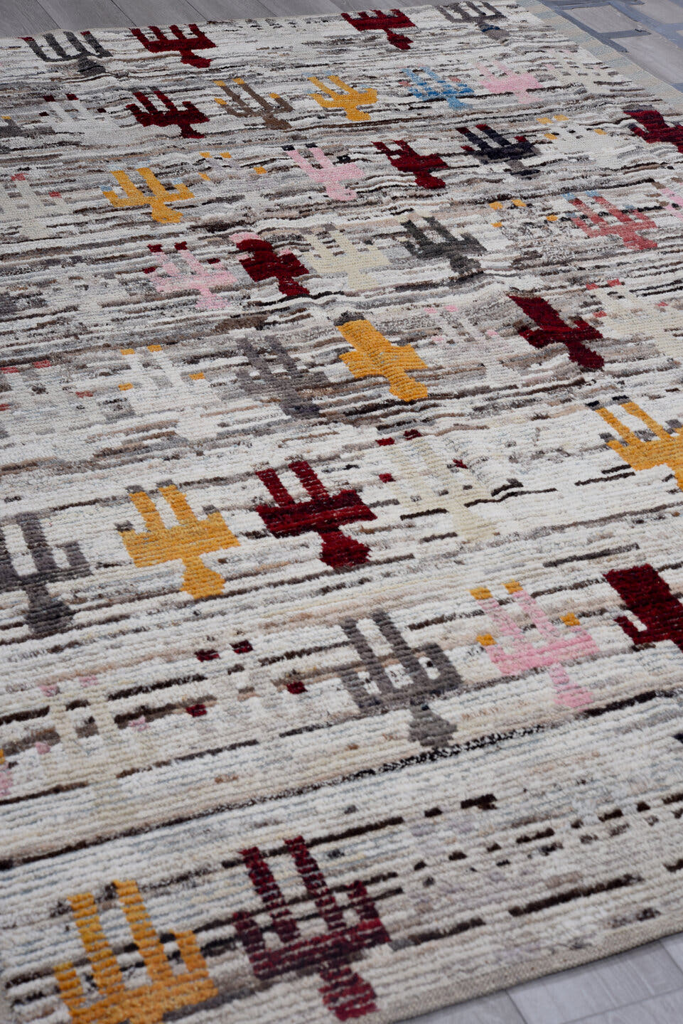 7' x 9' one-of-a-kind handmade vintage Tulu large size rug. Color palette: ivory, gray, burgundy, gold, pink, taupe