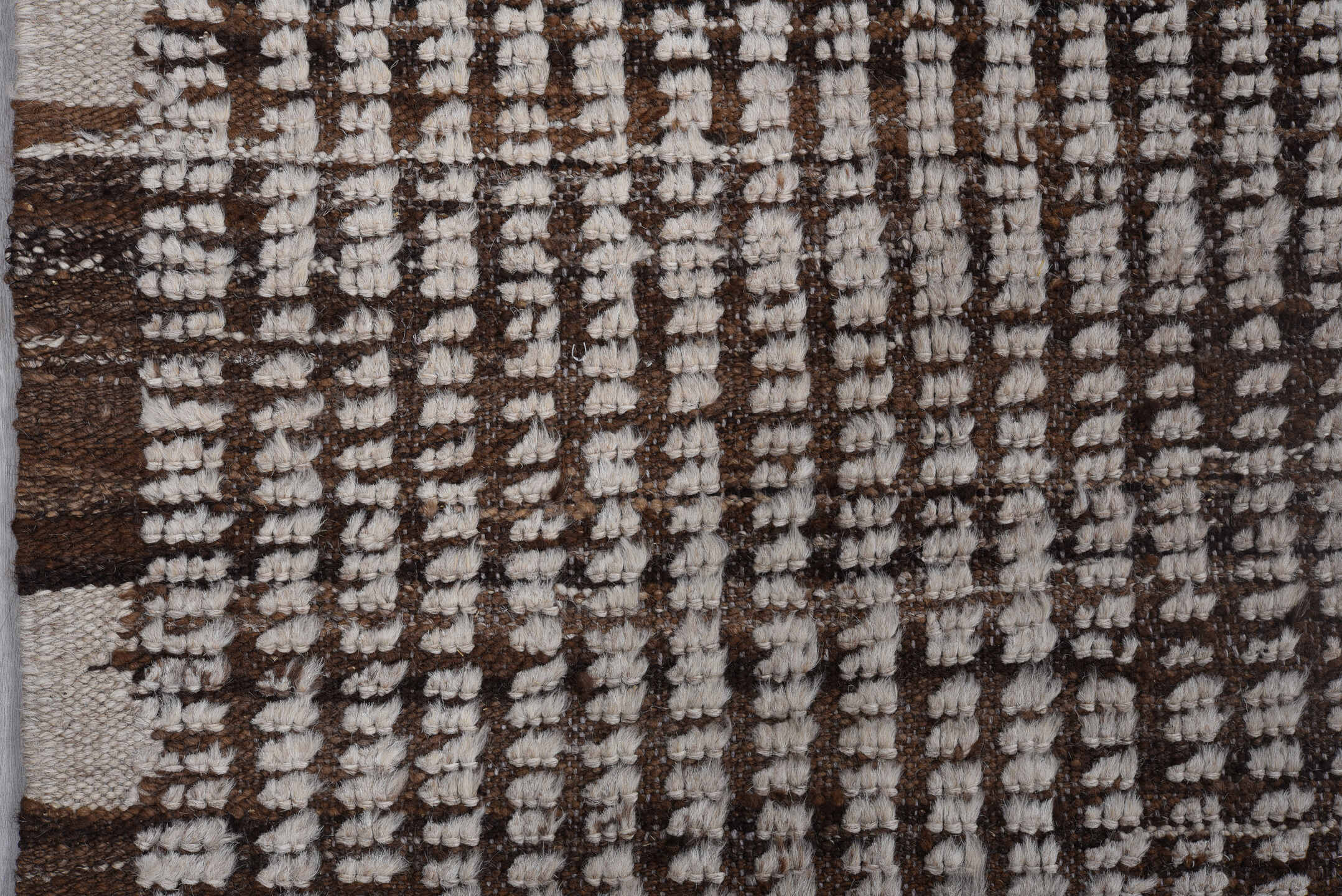 4' x 12' one-of-a-kind handmade vintage Tulu runner rug. Color palette: ivory, brown, espresso, black
