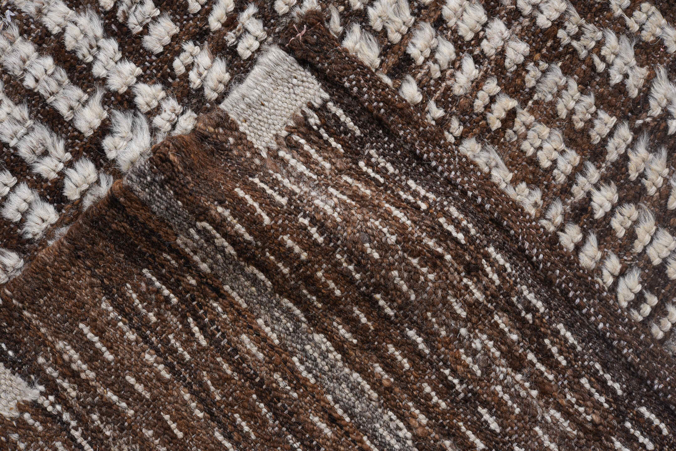 4' x 12' one-of-a-kind handmade vintage Tulu runner rug. Color palette: ivory, brown, espresso, black