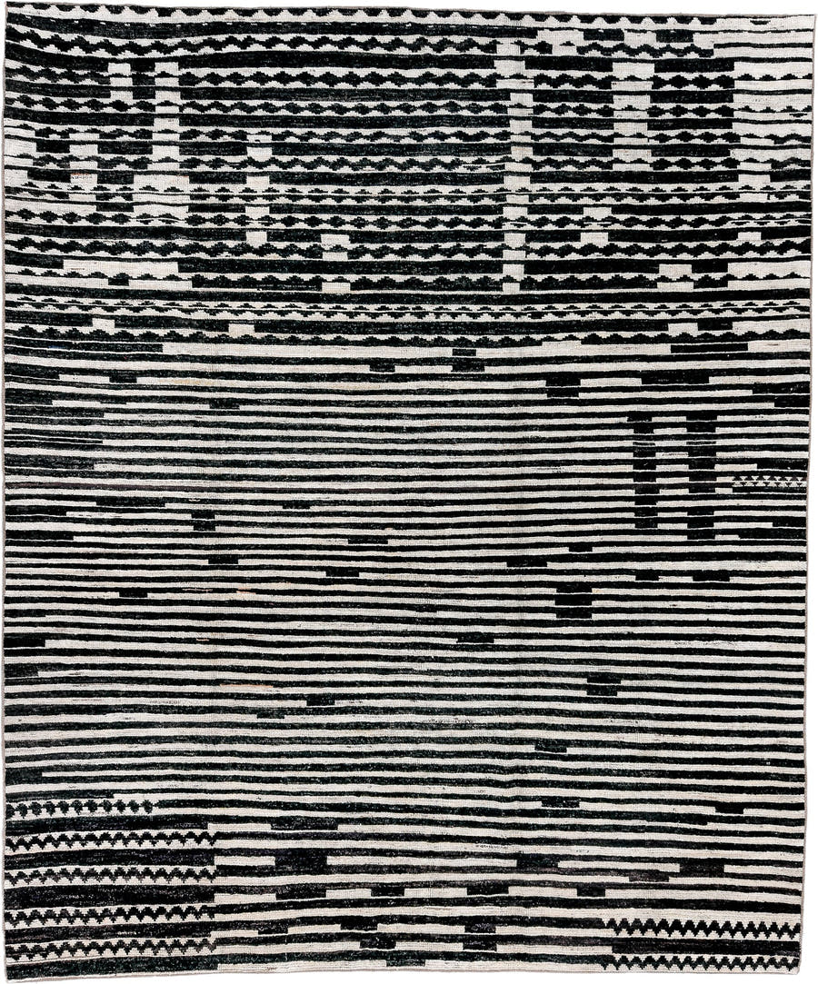 8' x 9' one-of-a-kind handmade vintage Tulu rug. Color palette: ivory, black, charcoal, gray