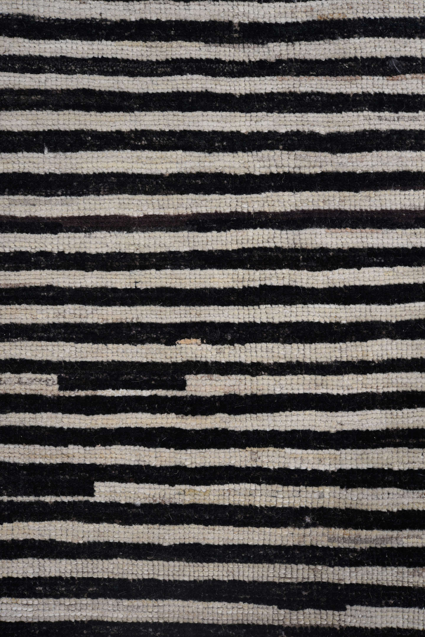 8' x 9' one-of-a-kind handmade vintage Tulu rug. Color palette: ivory, black, charcoal, gray
