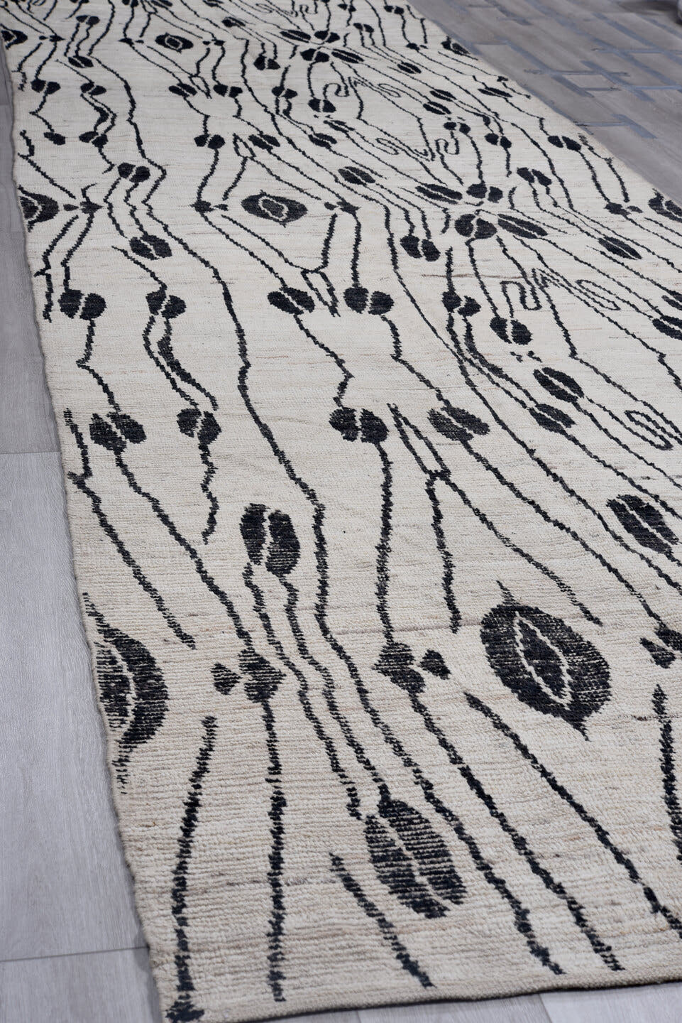 5' x 19' one-of-a-kind handmade vintage Tulu rug. Color palette: ivory, black, charcoal, gray