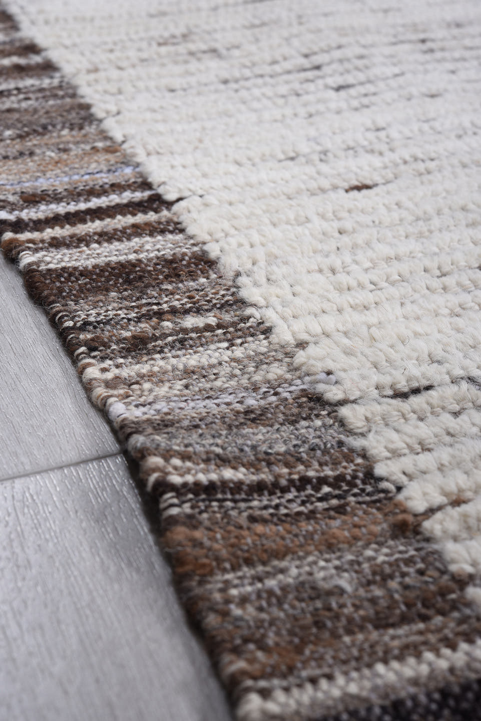 9' x 11' one-of-a-kind handmade vintage Tulu large size rug. Color palette: ivory, charcoal, taupe, brown, gray, black