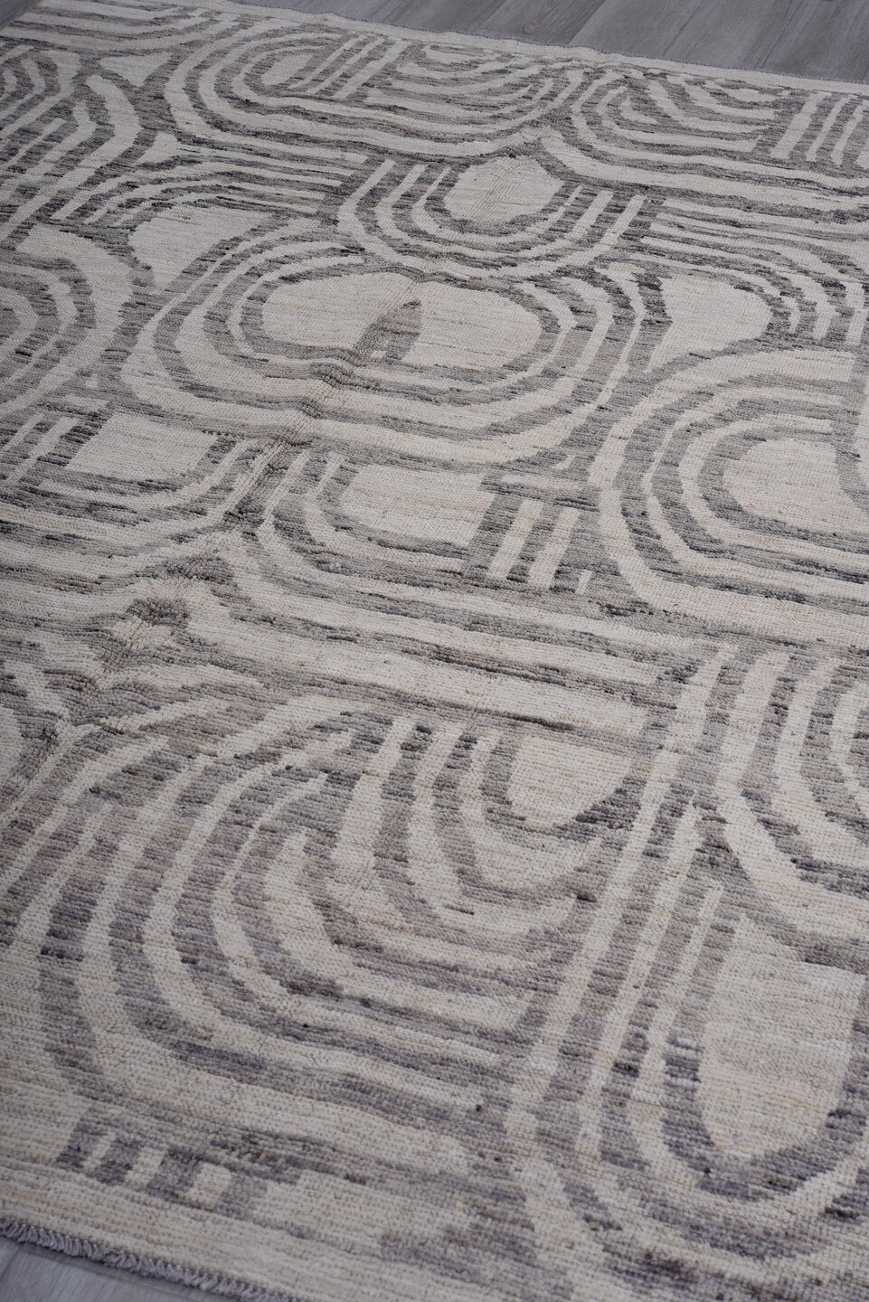 7' x 9' one-of-a-kind handmade vintage Tulu rug. Color palette: ivory, gray, charcoal, taupe, black, beige