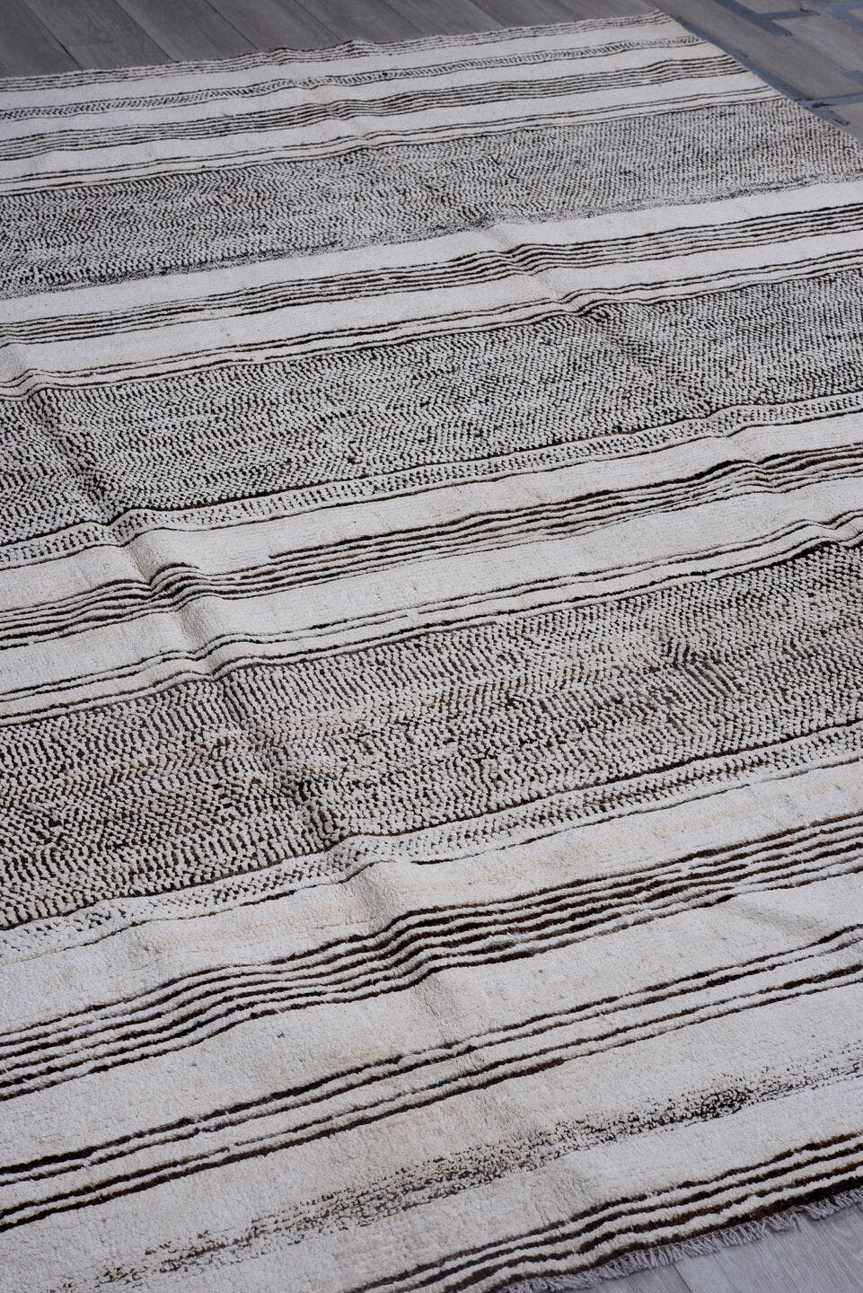 7' x 9' one-of-a-kind handmade vintage Tulu large size rug. Color palette: ivory, charcoal, gray, black