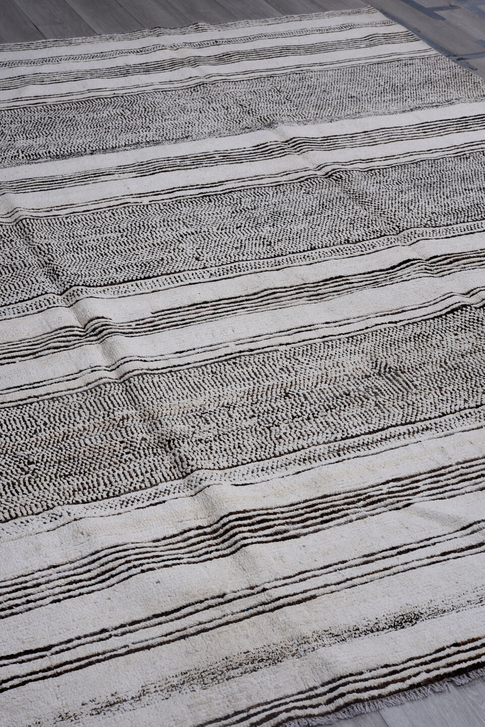 7' x 9' one-of-a-kind handmade vintage Tulu large size rug. Color palette: ivory, charcoal, gray, black