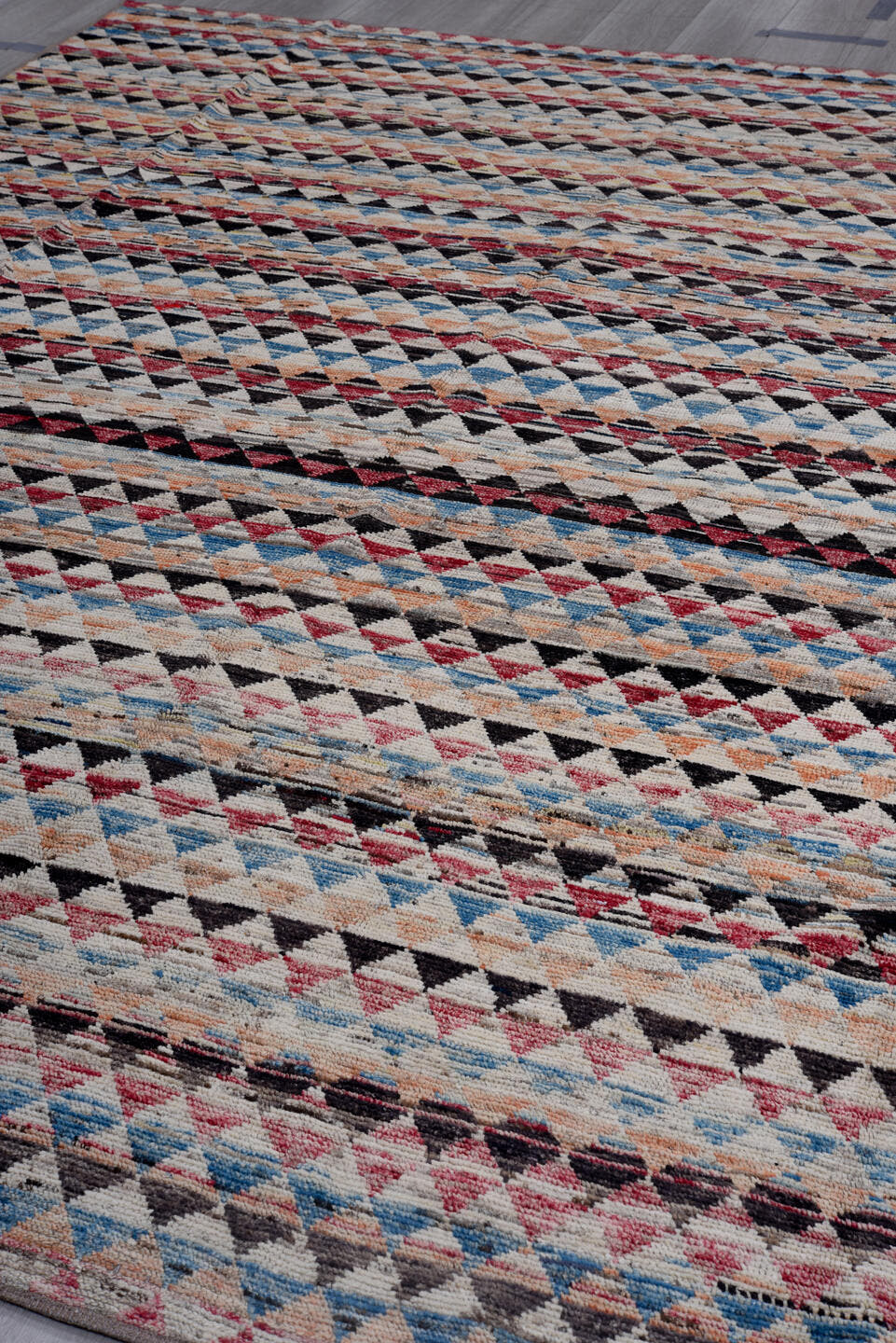 8' x 11' one-of-a-kind handmade vintage Tulu large size rug. Color palette: ivory, charcoal, crimson, sky blue, peach, slate