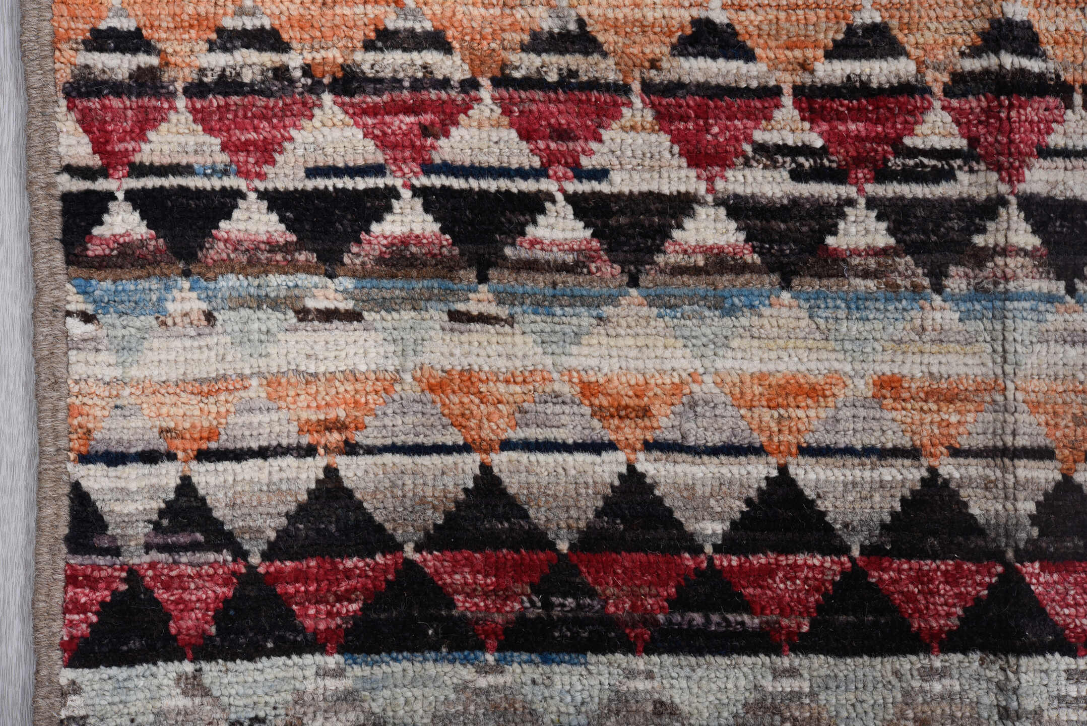 8' x 11' one-of-a-kind handmade vintage Tulu large size rug. Color palette: ivory, charcoal, crimson, sky blue, peach, slate