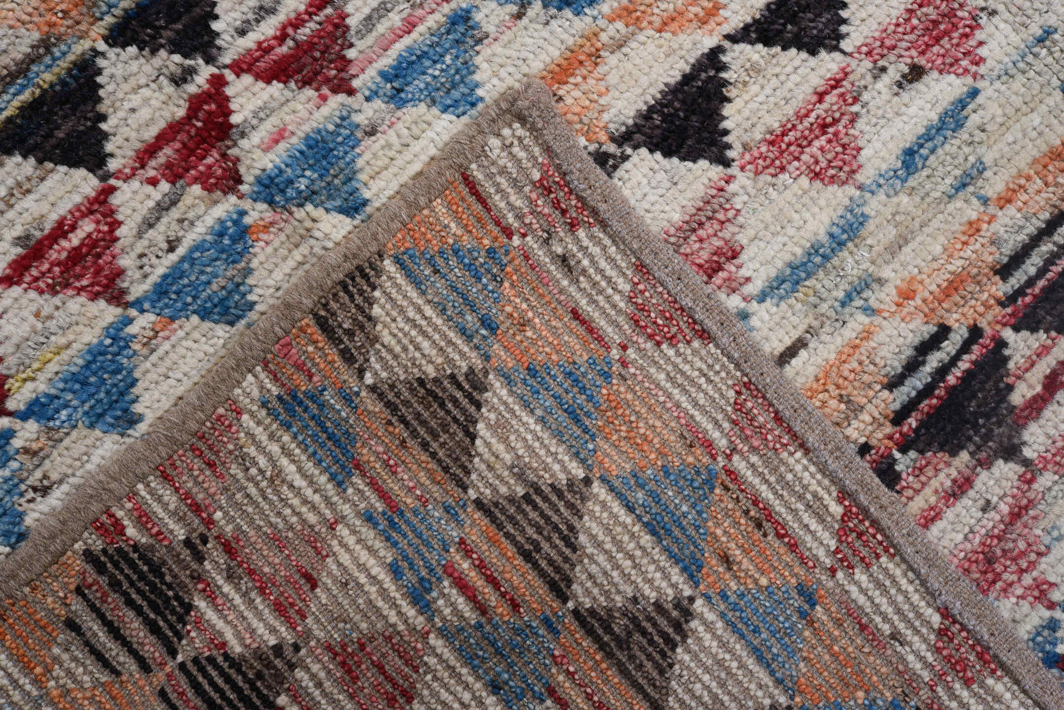 8' x 11' one-of-a-kind handmade vintage Tulu large size rug. Color palette: ivory, charcoal, crimson, sky blue, peach, slate