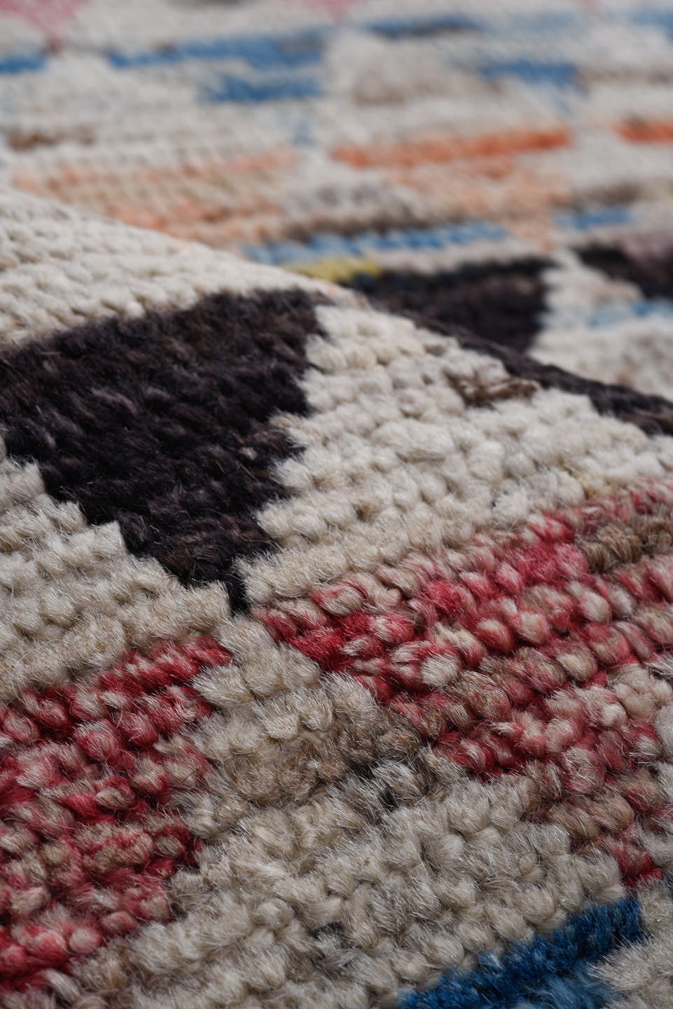 8' x 11' one-of-a-kind handmade vintage Tulu large size rug. Color palette: ivory, charcoal, crimson, sky blue, peach, slate